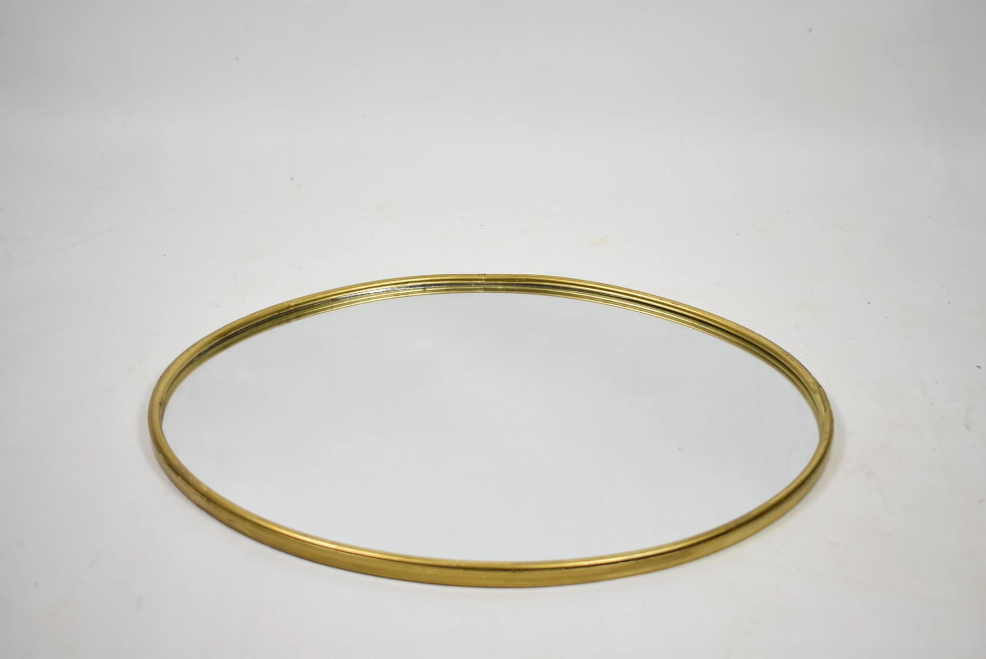 Wall mirror, oval, golden brass, Poland, 1980s - 84144
