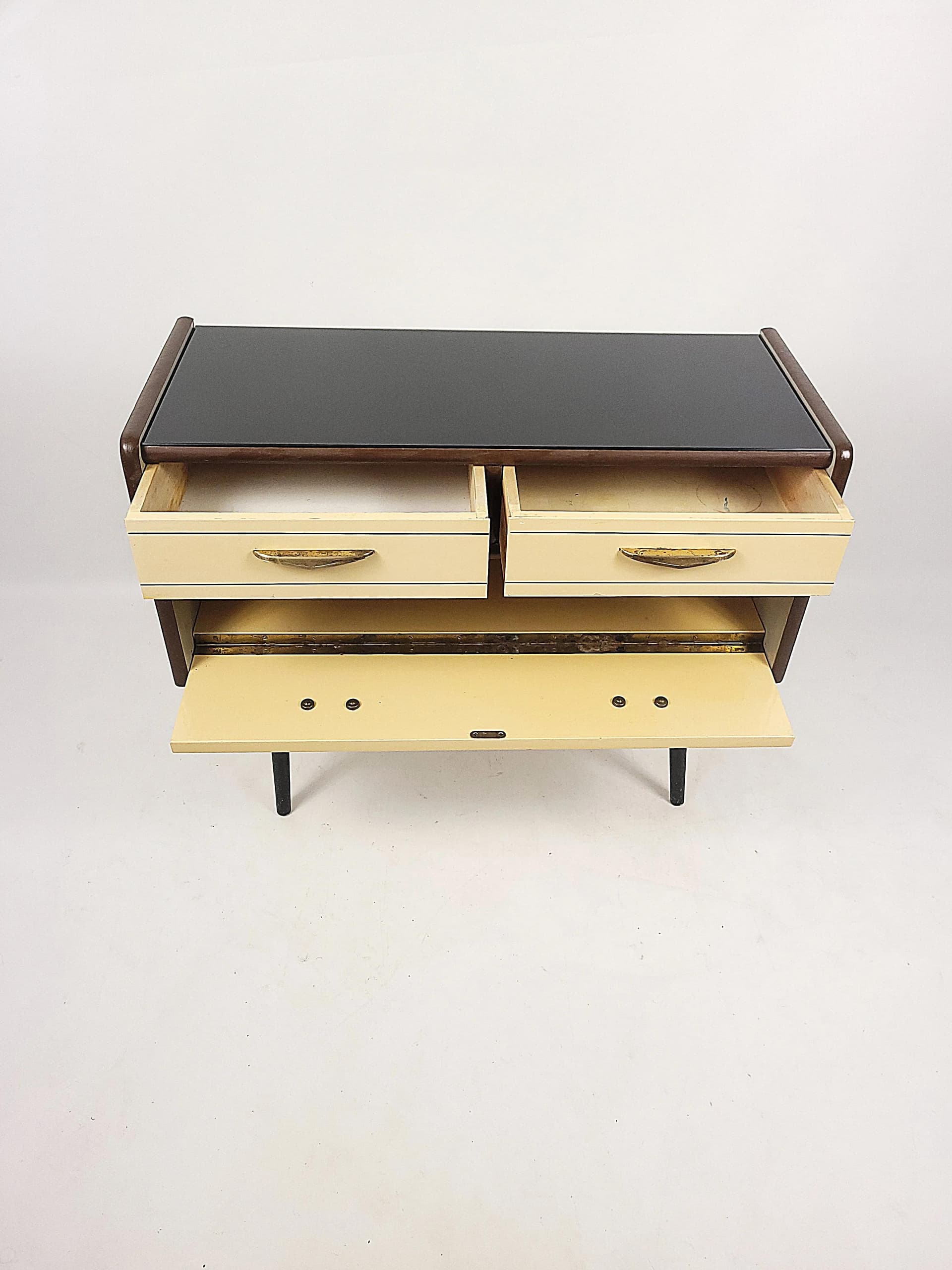 Chest of Drawers Rockabilly, beige wood, black lakobel glass, Poland, 1950s. - 84077