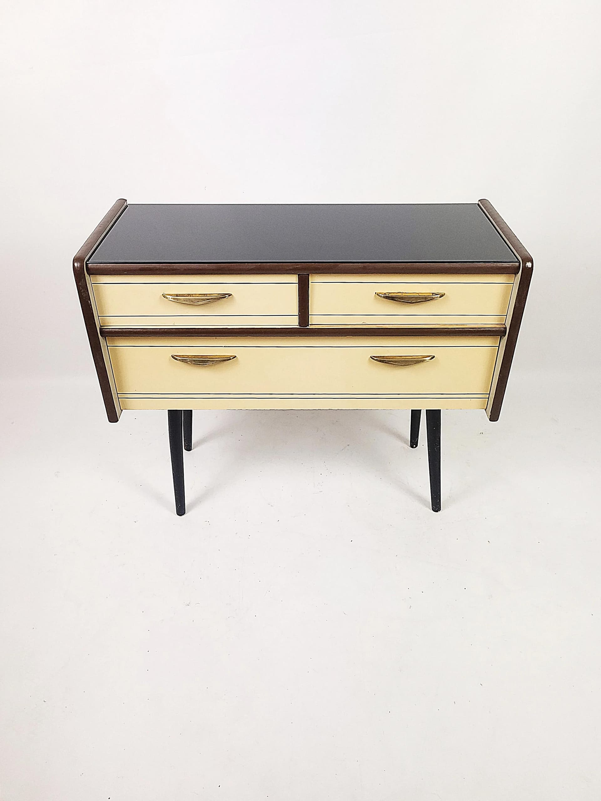Chest of Drawers Rockabilly, beige wood, black lakobel glass, Poland, 1950s. - 84082