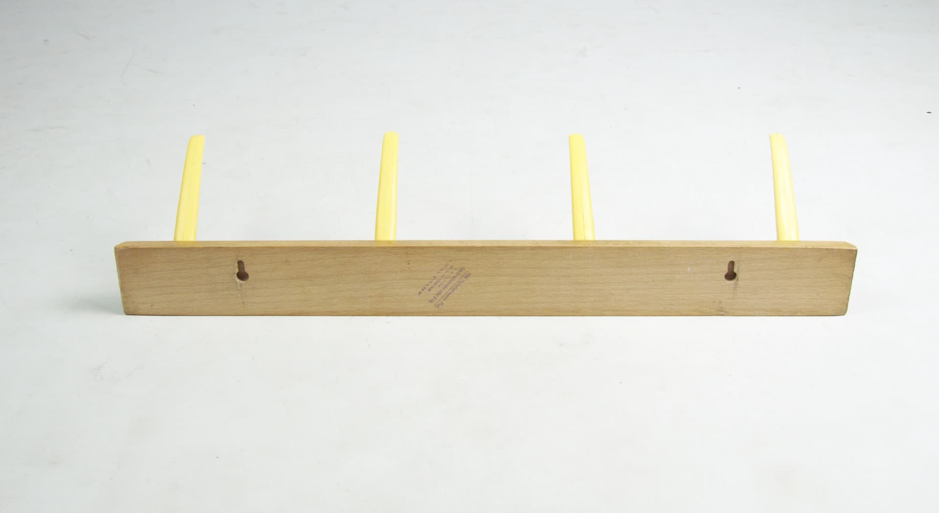 Wall-mounted rack, brown wood, yellow plastic, Germany, 1970s. - 83772