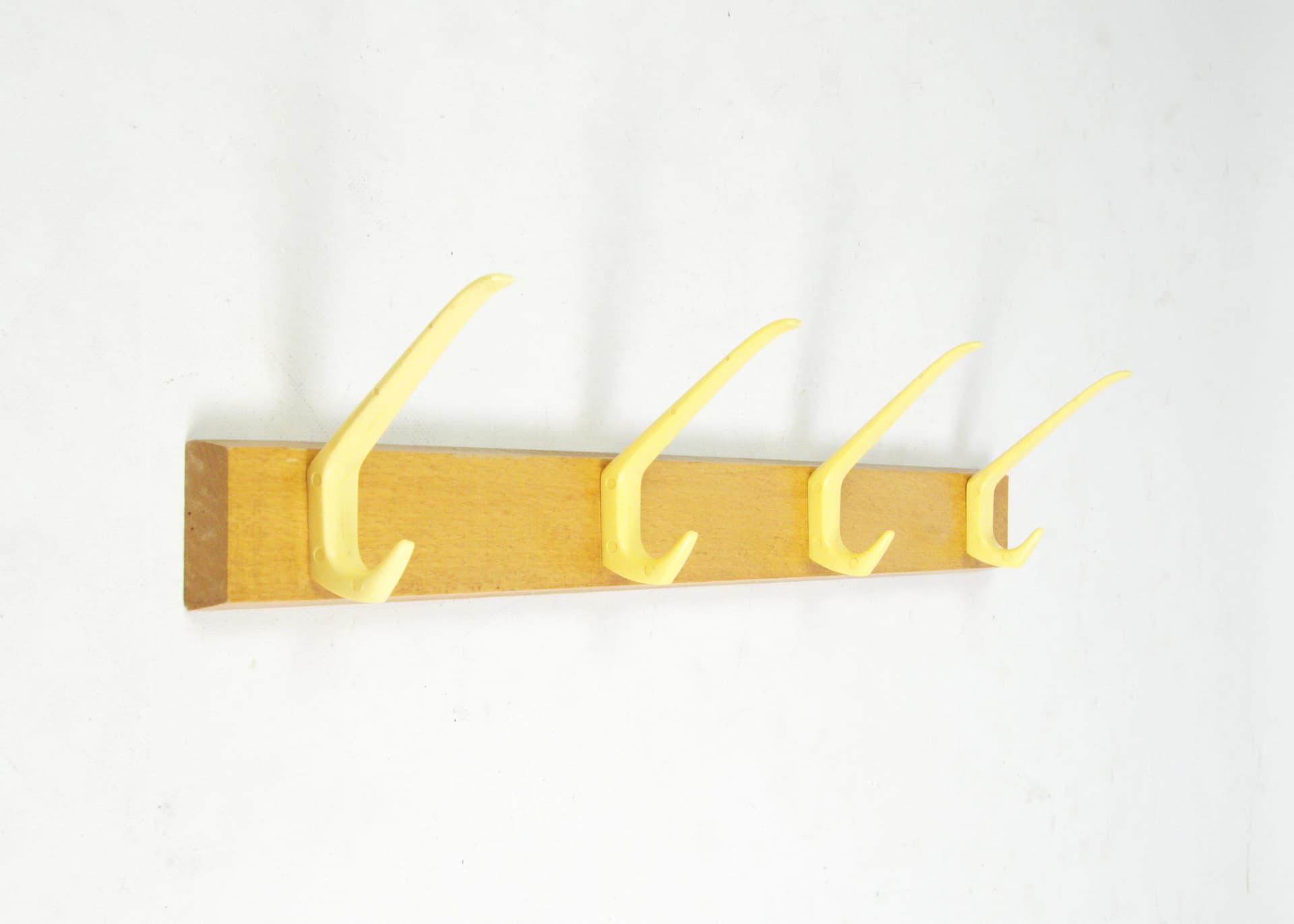 Wall-mounted rack, brown wood, yellow plastic, Germany, 1970s. - 83776