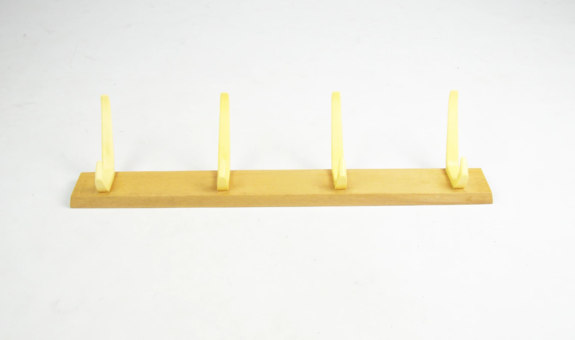 Wall-mounted rack, brown wood, yellow plastic, Germany, 1970s. - 83775