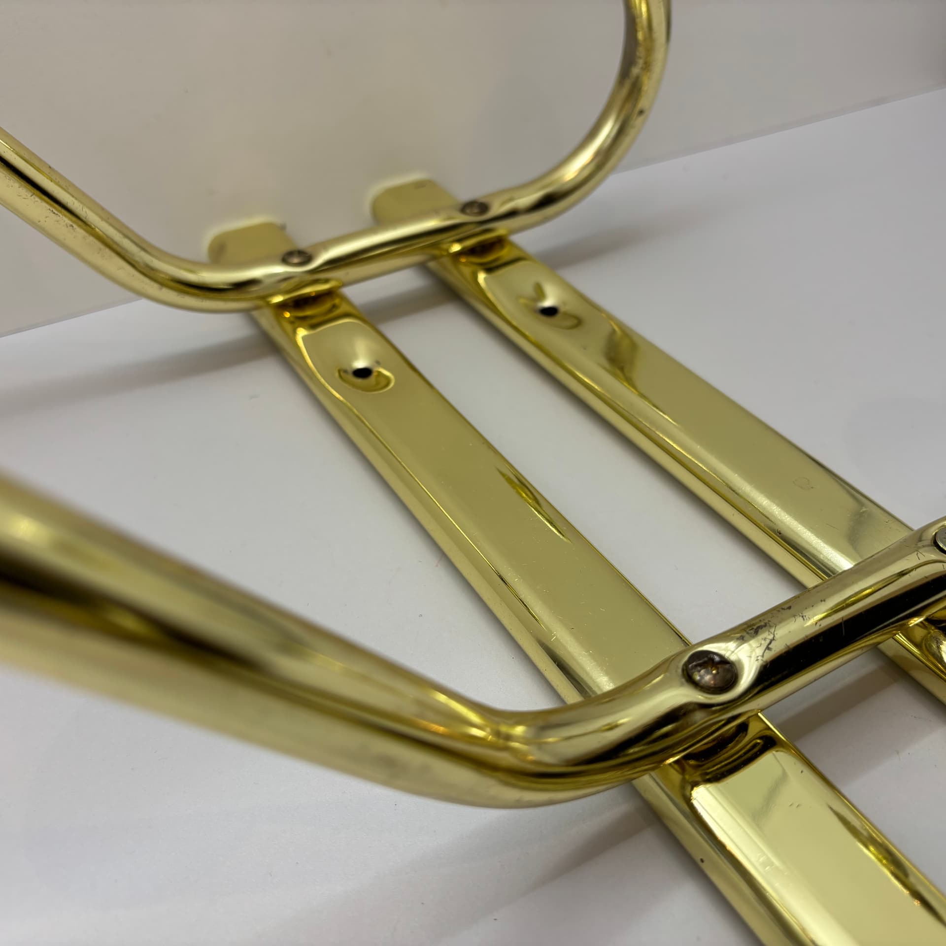 Wall-mounted rack, golden steel, Germany, 1970s. - 91481