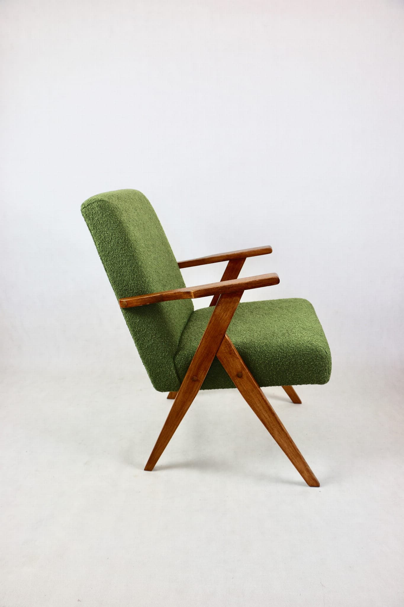 Armchair, green bouclé, walnut, Poland, 1970s. - 108043