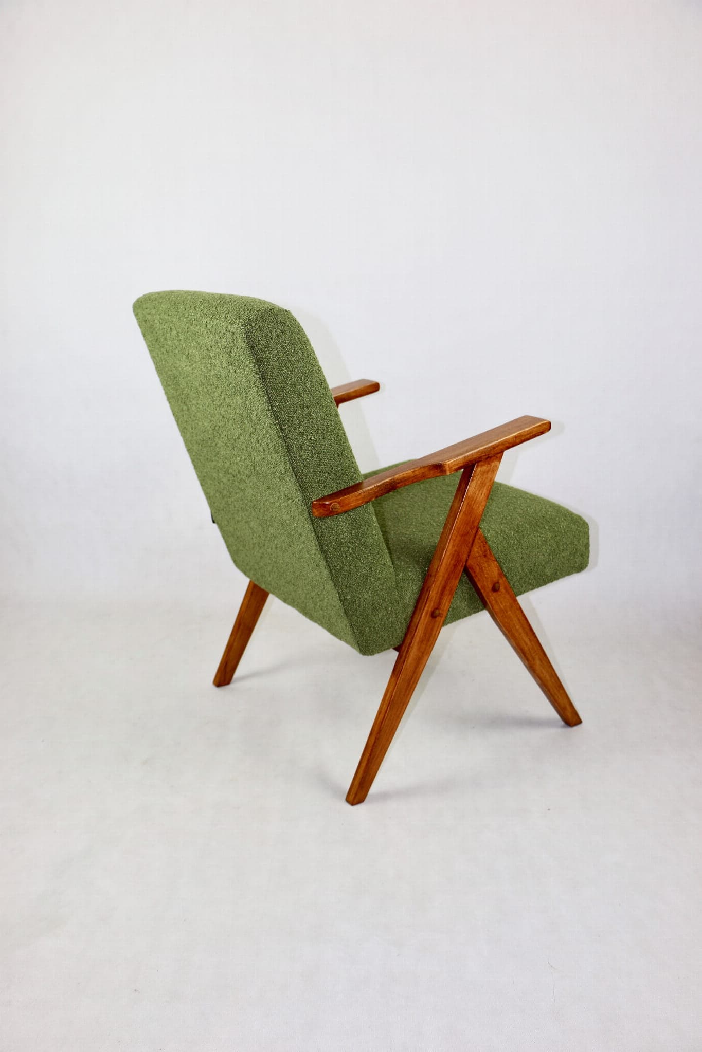 Armchair, green bouclé, walnut, Poland, 1970s. - 108042