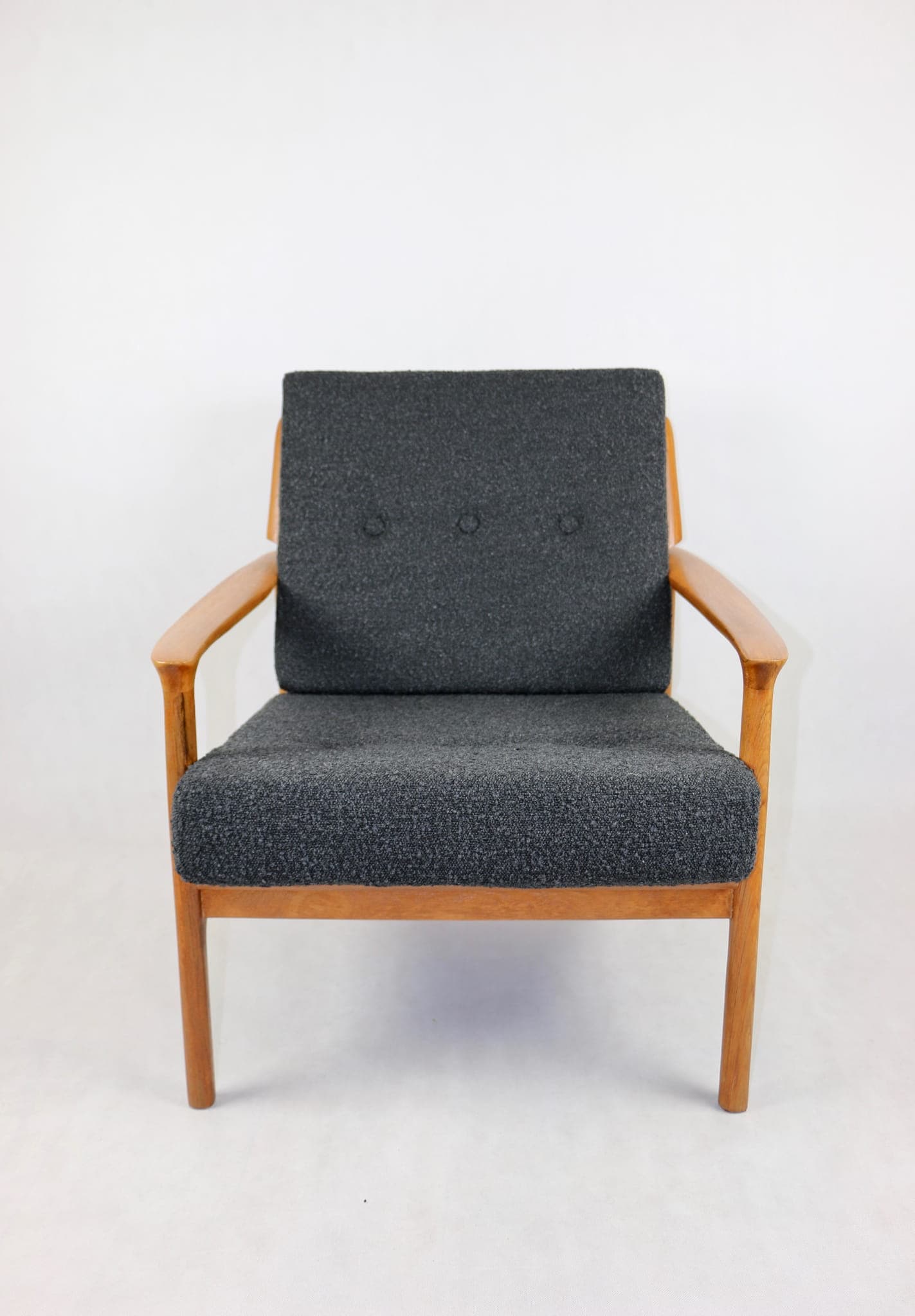 Armchair, black bouclé, teak, Denmark, 1970s. - 107286