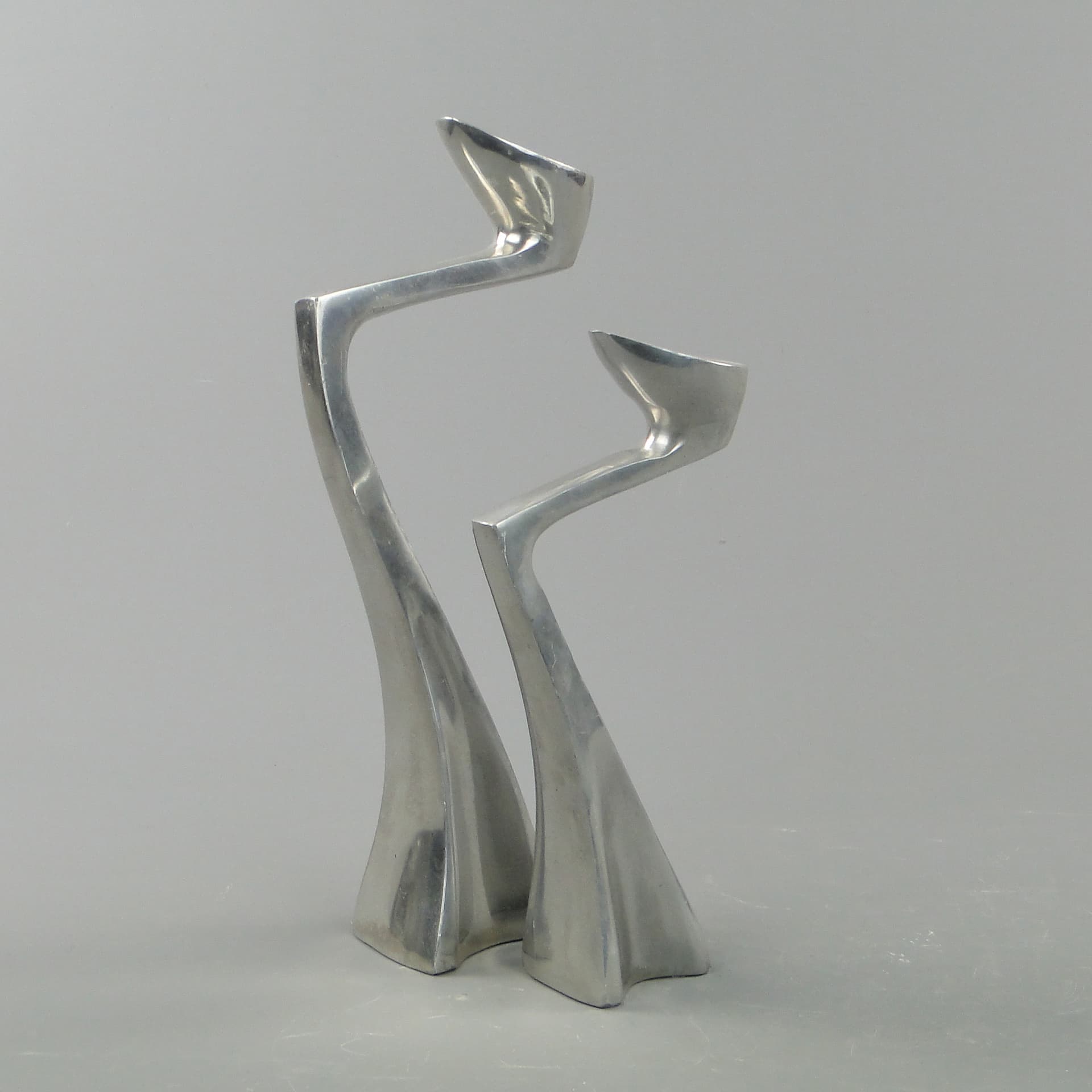 Pair of candle holders Arclumis, silver aluminum, by M. Hilton, United Kingdom, 1980s. - 7997