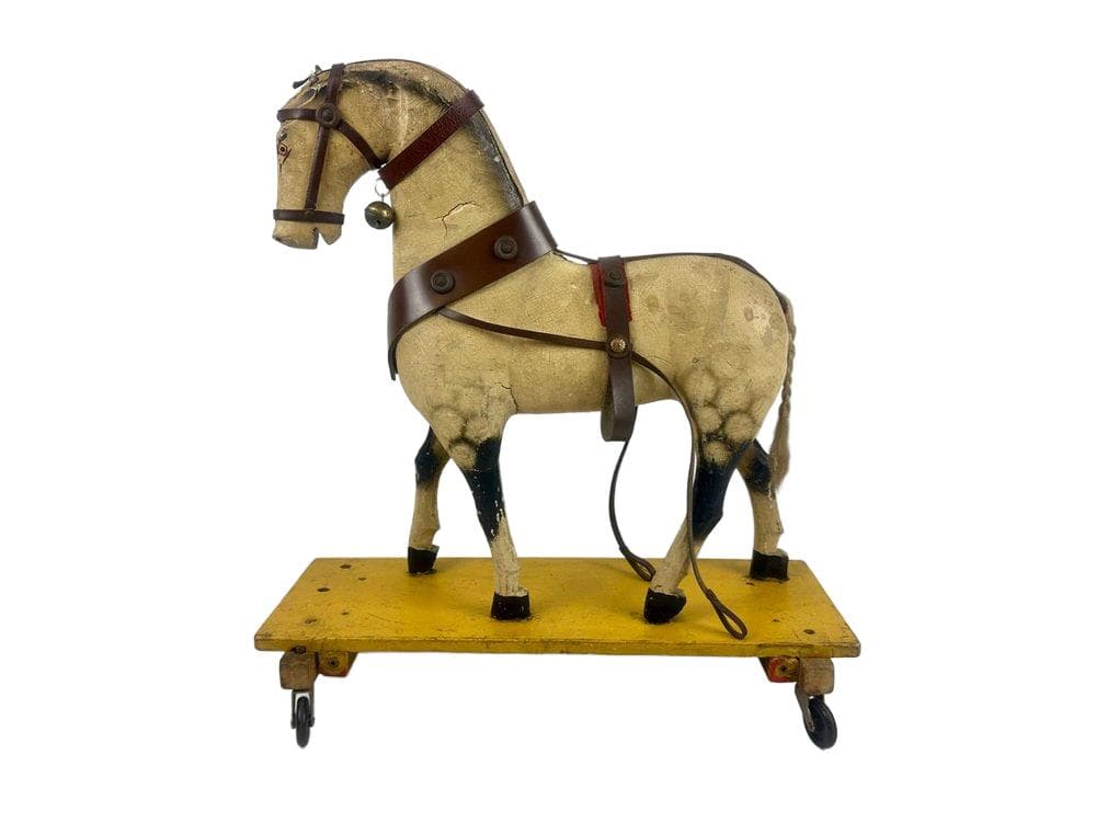 Horse figurine on wheels, beige wood, early 20th c.
