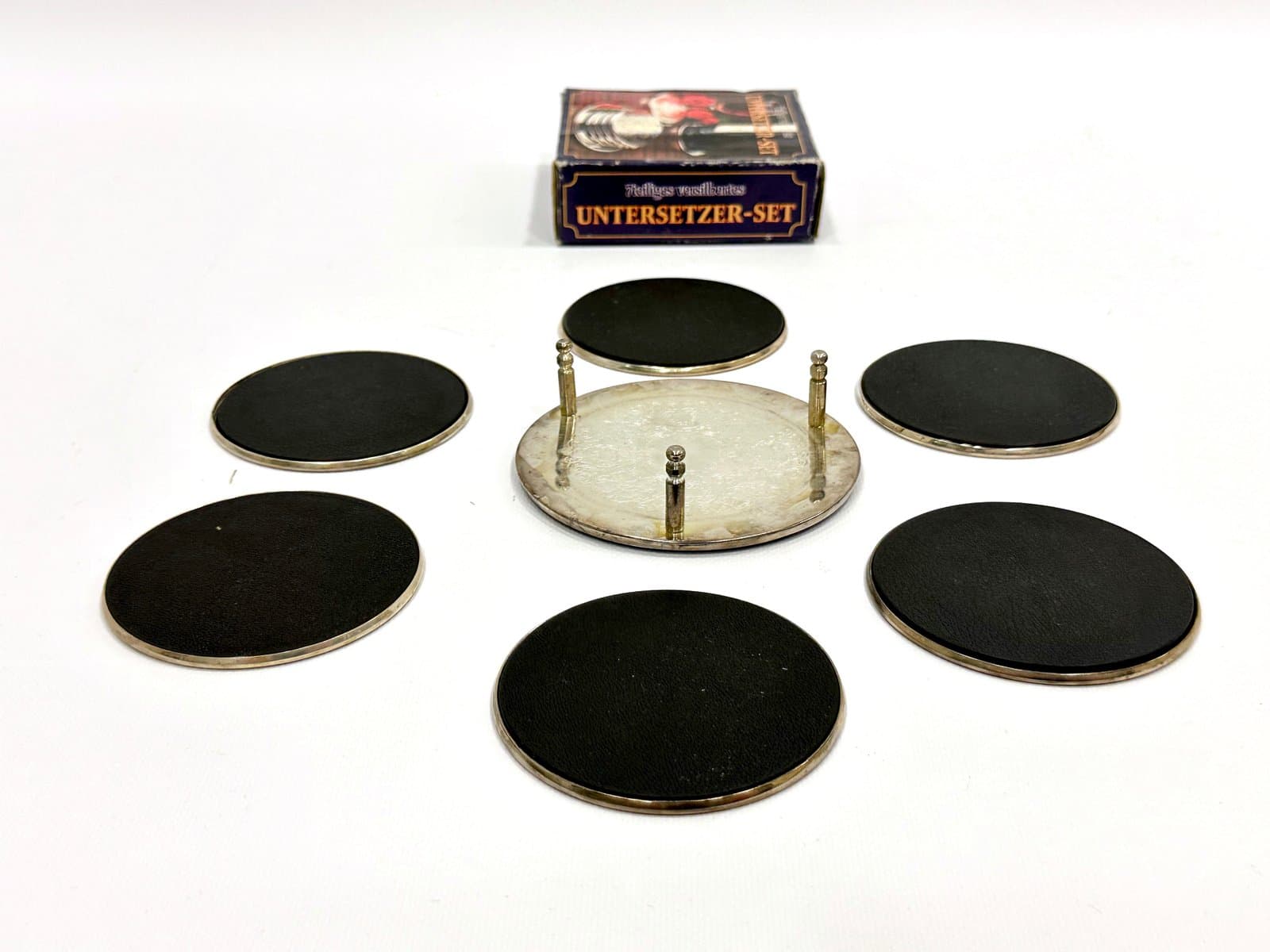 Zestaw siedmiu podstawek, srebrny, metal srebrzony, Niemcy, lata 80. - 155100