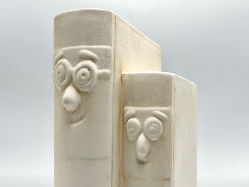 Bookend Happy Book, beige ceramic, Germany, 1970s. - 156110