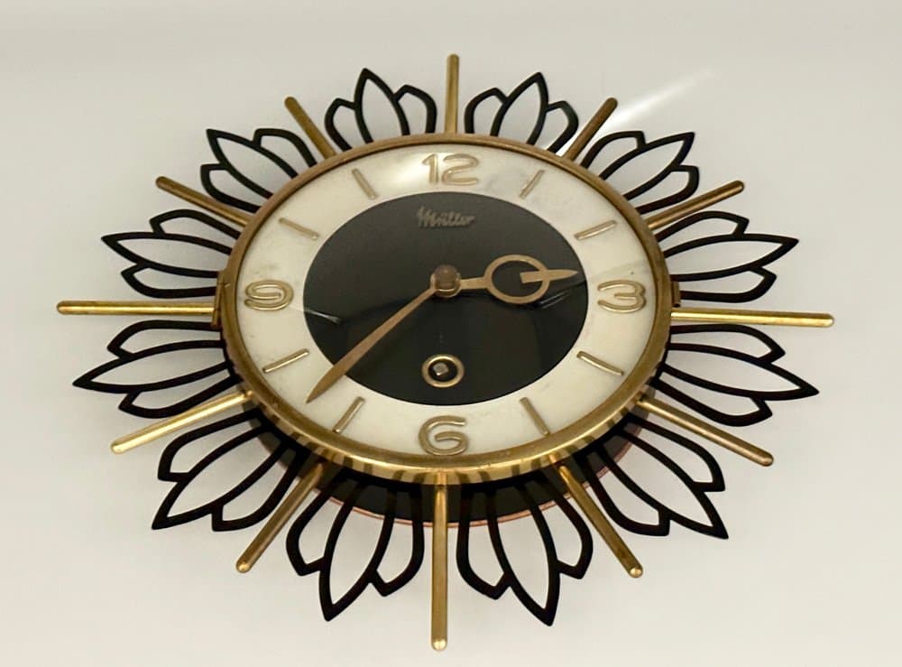 Wall Clock Sunburst, black gold, brass steel glass, Germany, 1960s. - 156195