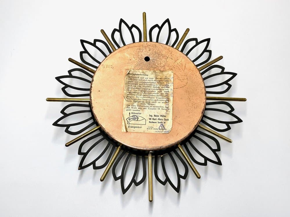 Wall Clock Sunburst, black gold, brass steel glass, Germany, 1960s. - 156193
