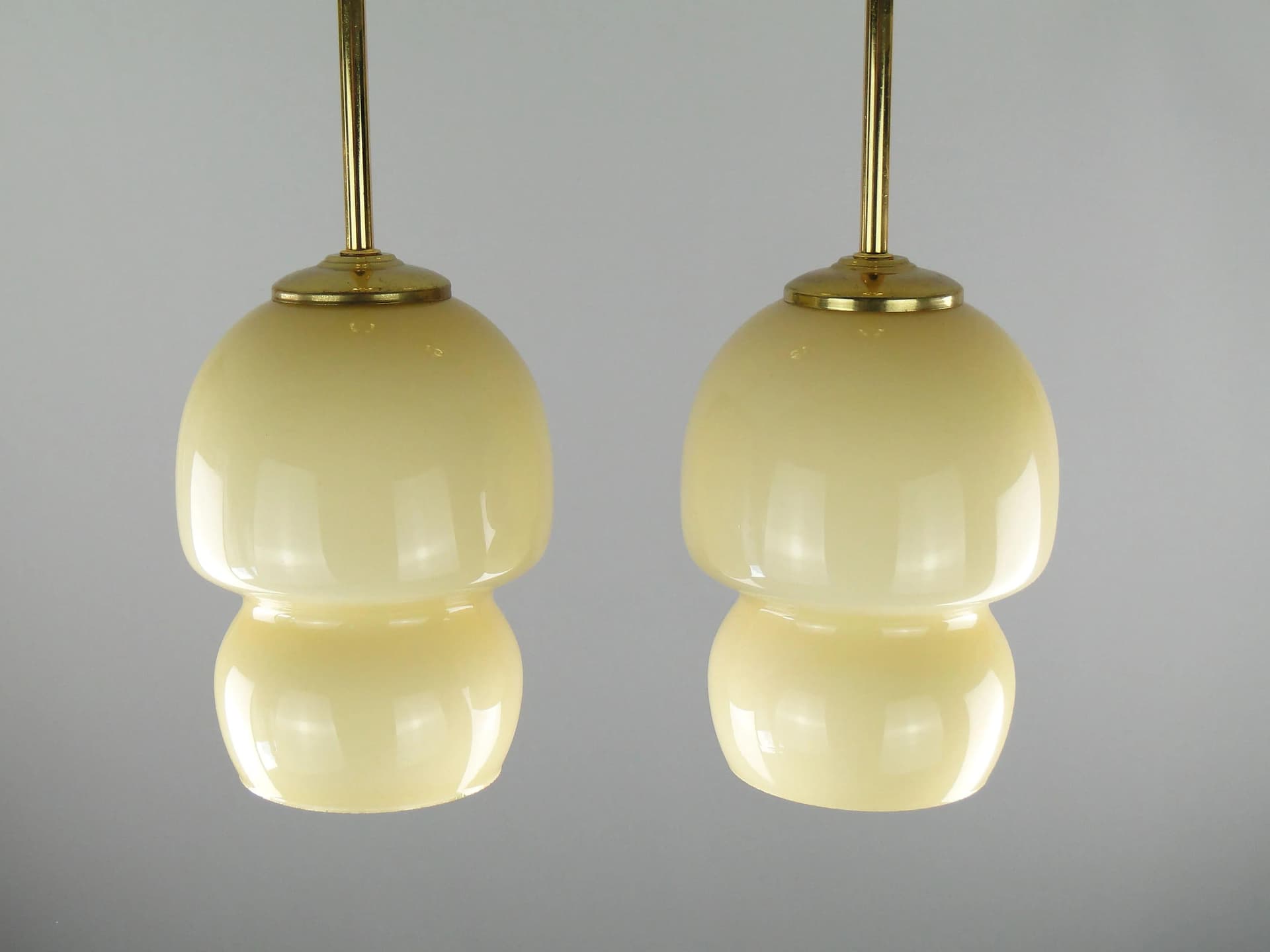 Pair of ceiling lamps, ecru glass, brass, Poland, 1950s. - 163286