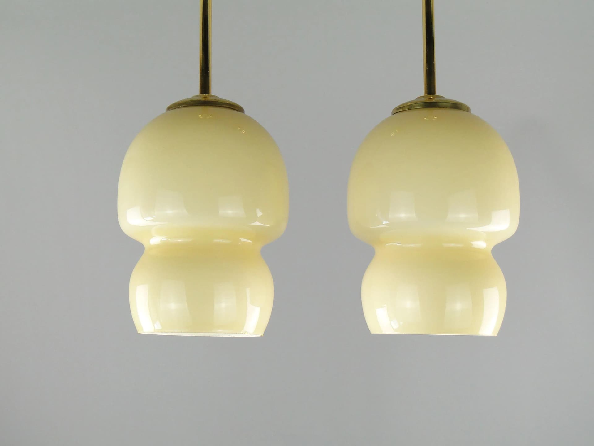 Pair of ceiling lamps, ecru glass, brass, Poland, 1950s. - 163284