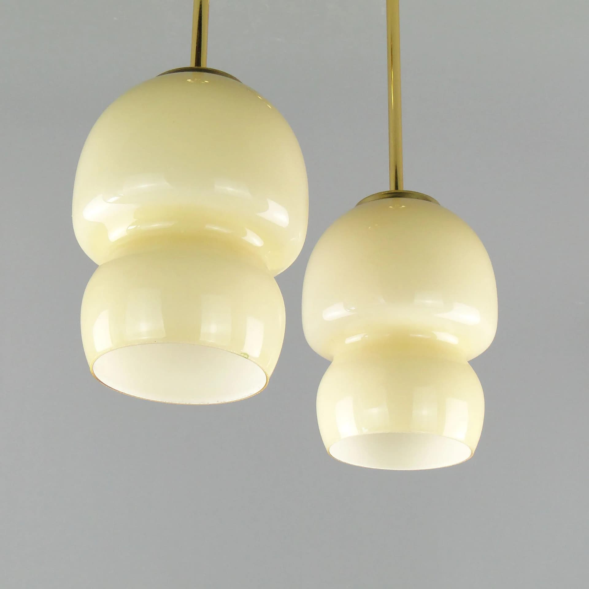 Pair of ceiling lamps, ecru glass, brass, Poland, 1950s. - 163289
