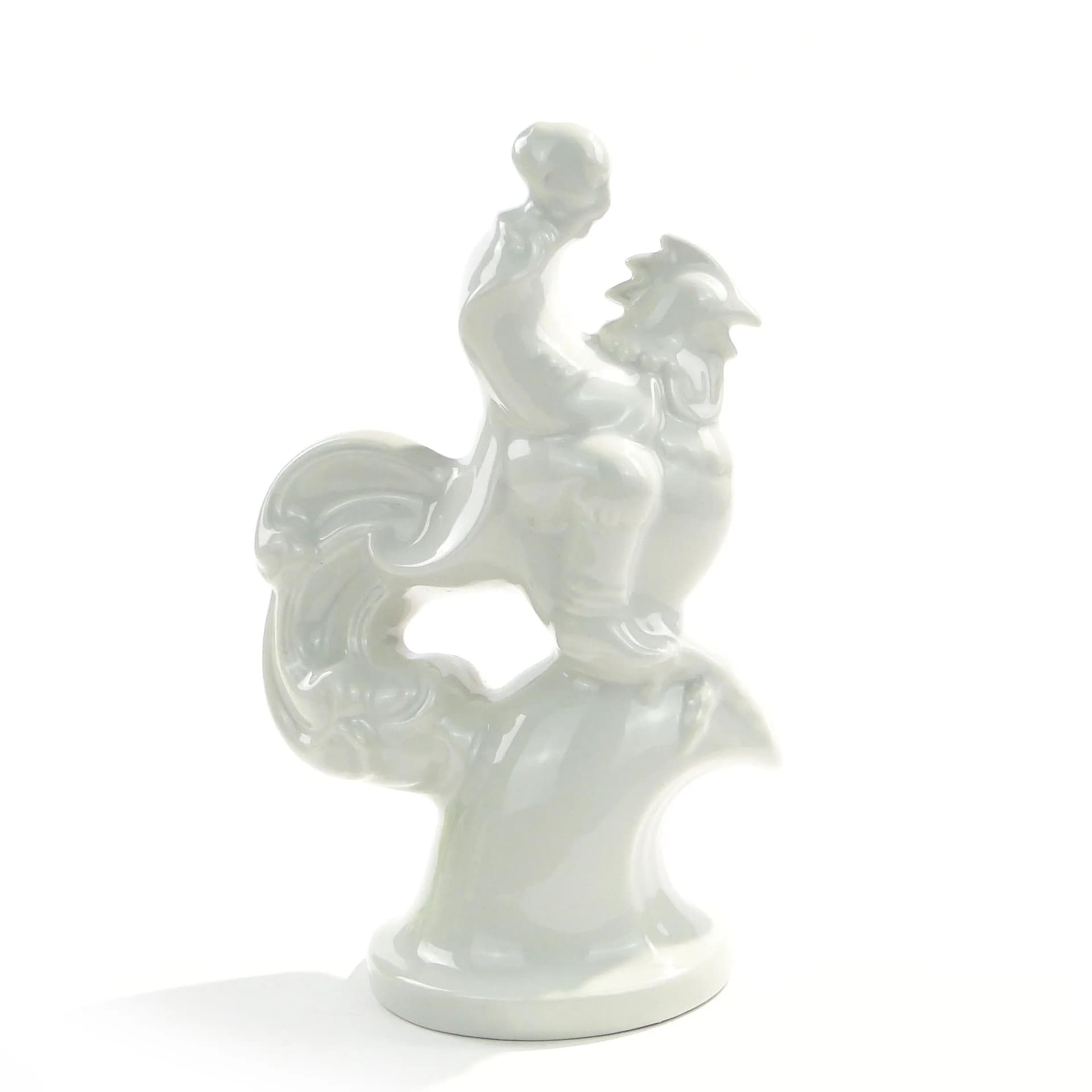 Figurka Twardowski na kogucie, porcelana biała, proj. T. Szafran, Ćmielów, Polska, lata 30. - 162611