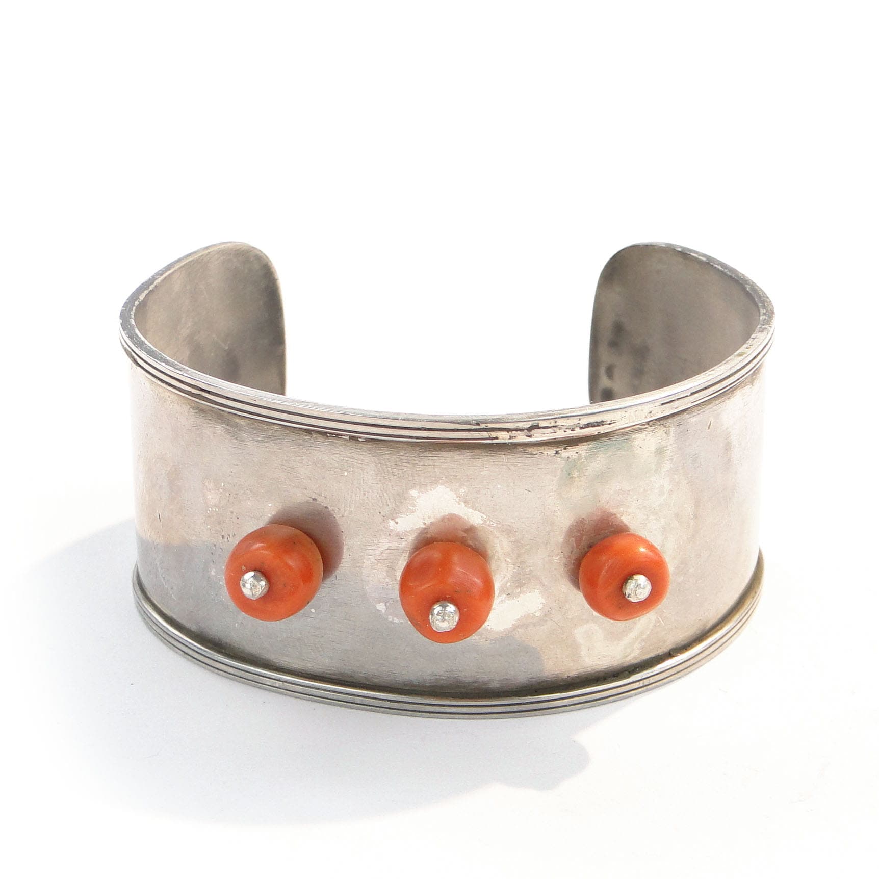 Cuff bracelet, orange coral, silver, by A. Folfas, Poland, 1980s.