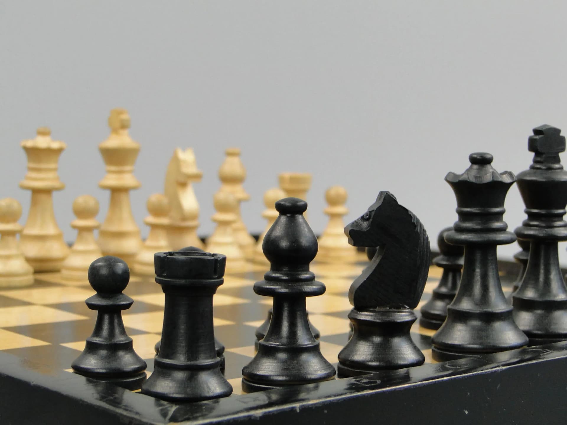 Chess set, black, light wood, black wood, Poland, 1960s. - 11606