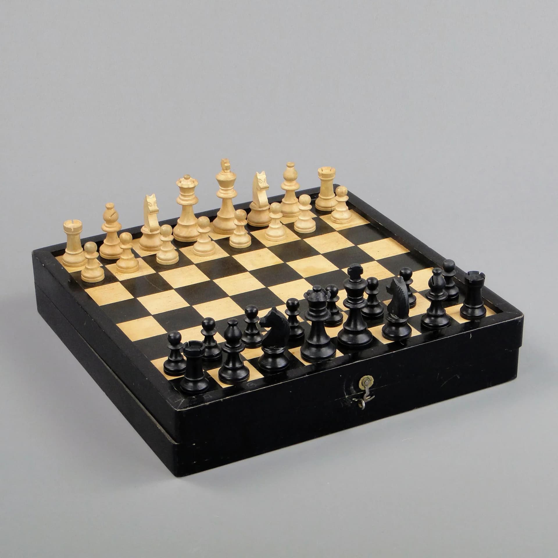 Chess set, black, light wood, black wood, Poland, 1960s. - 11603
