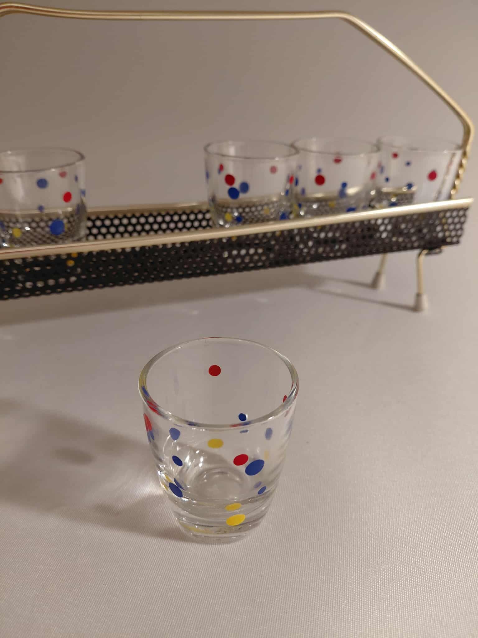 Set of shot glasses with stand, multicolor, 1960s. - 176785