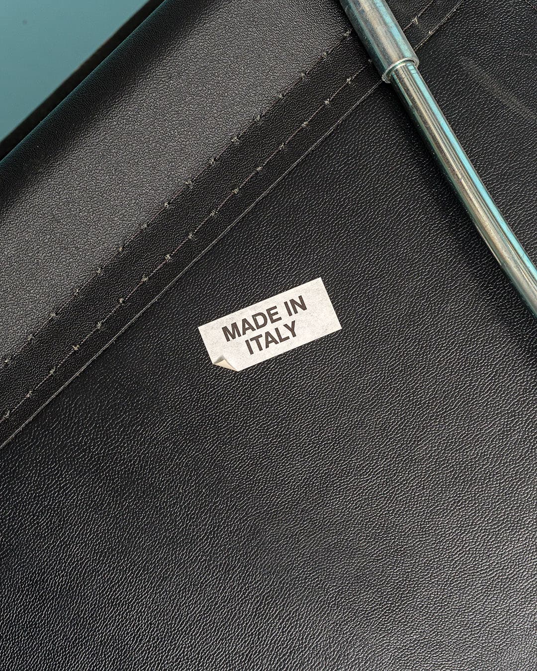 Chair, brown teak, black leather, Casala, Germany, 1970s. - 193518