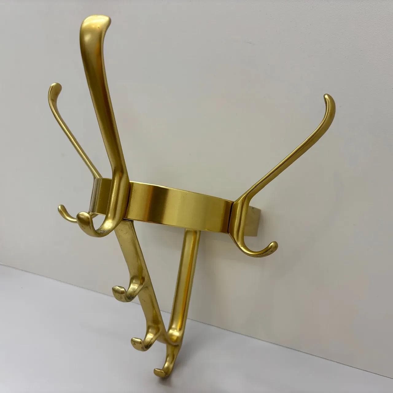 Wall-mounted coat rack, golden aluminum, Germany, 1970s. - 15580