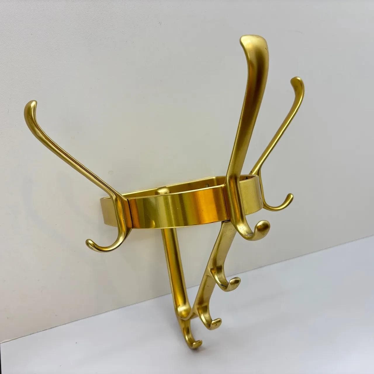 Wall-mounted coat rack, golden aluminum, Germany, 1970s. - 15583