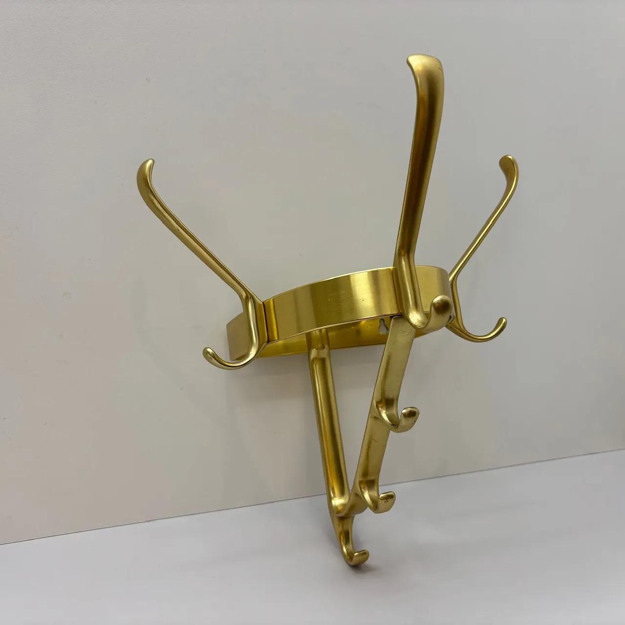Wall-mounted coat rack, golden aluminum, Germany, 1970s. - 15581