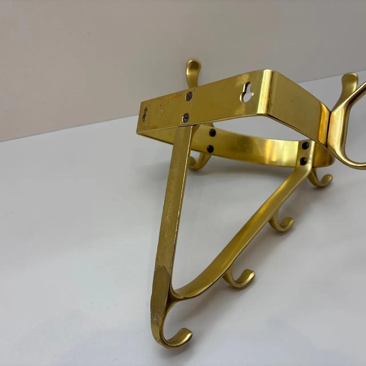 Wall-mounted coat rack, golden aluminum, Germany, 1970s. - 15575