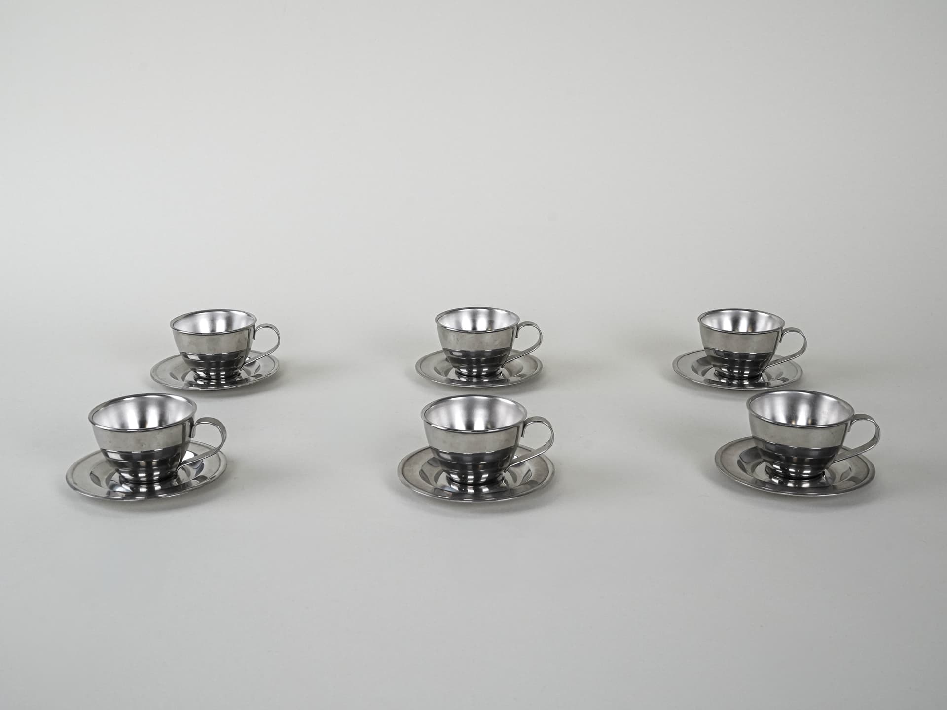 Set of cups, silver, stainless steel, Italy, 1980s. - 222782