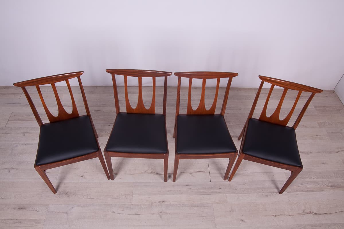 Set of four chairs Brasilia, brown teak, black leather, G-Plan, United Kingdom, 1950s. - 261513