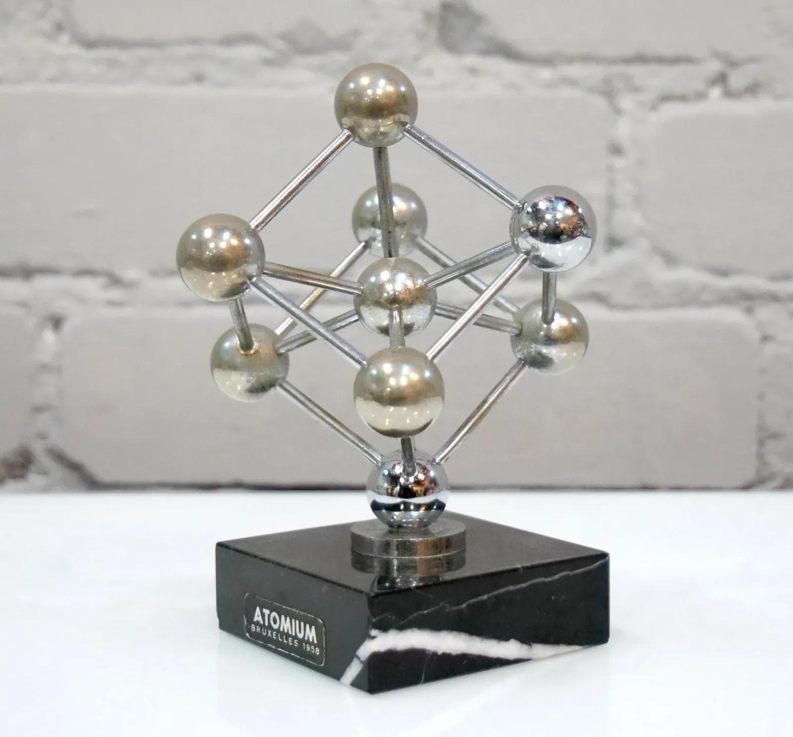 Atomium Model, silver metal, black marble, Belgium, 1950s. - 19133