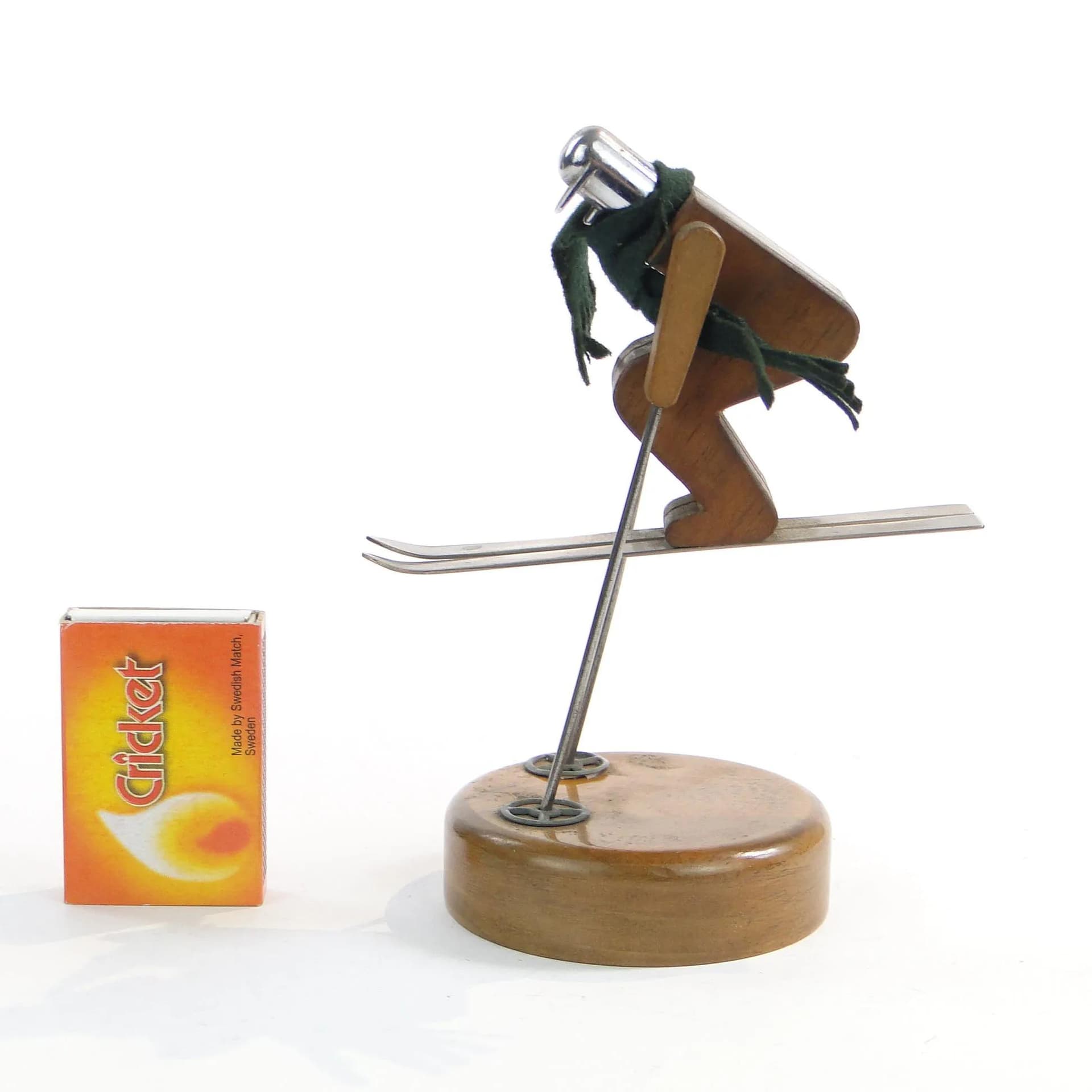 Kinetic skier figurine, brown wood, polished steel, green wool, Austria, 1960s - 19589