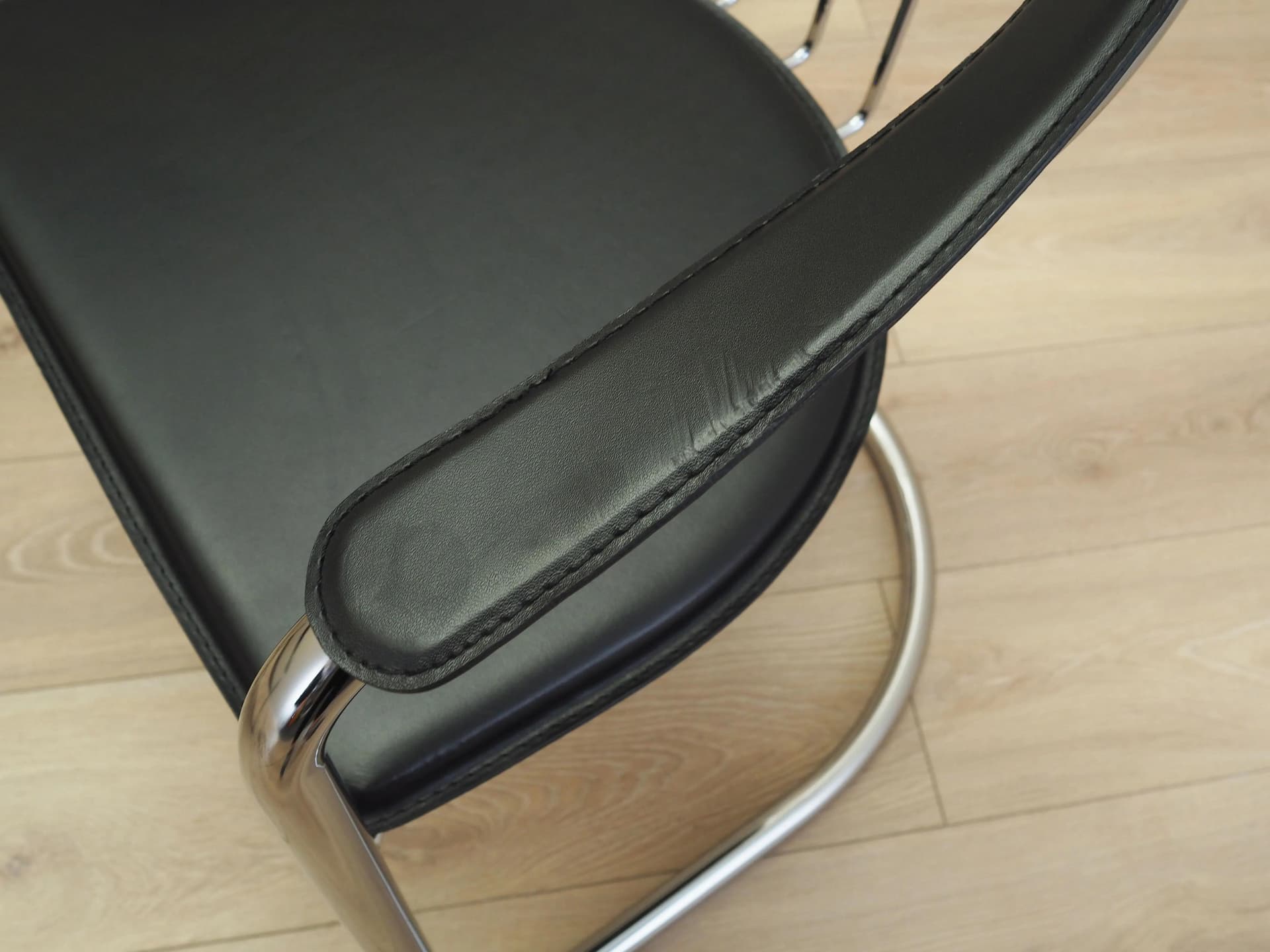 Set of four chairs, black leather, chromed metal, Italy, 1980s. - 22668