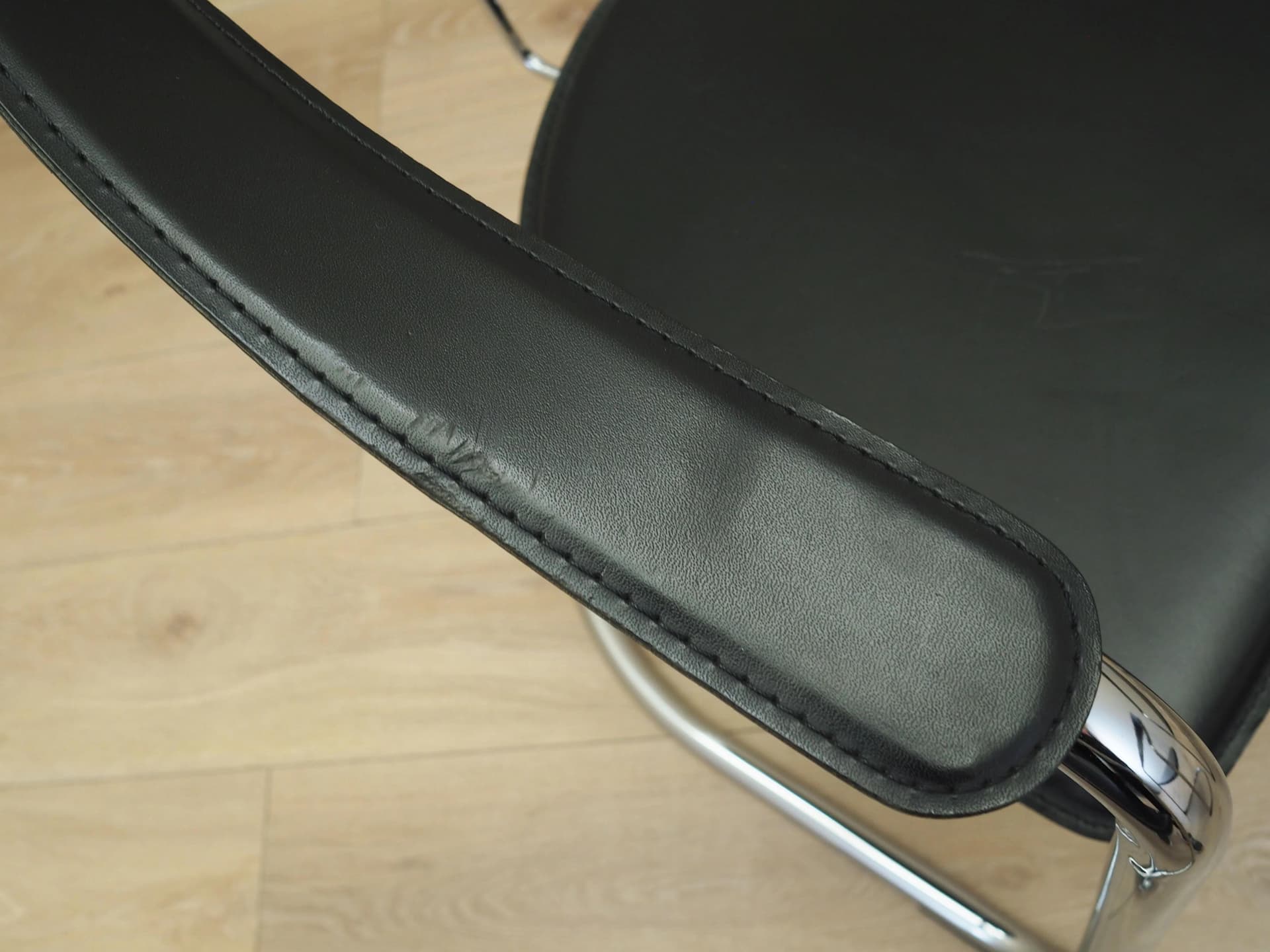 Set of four chairs, black leather, chromed metal, Italy, 1980s. - 22664