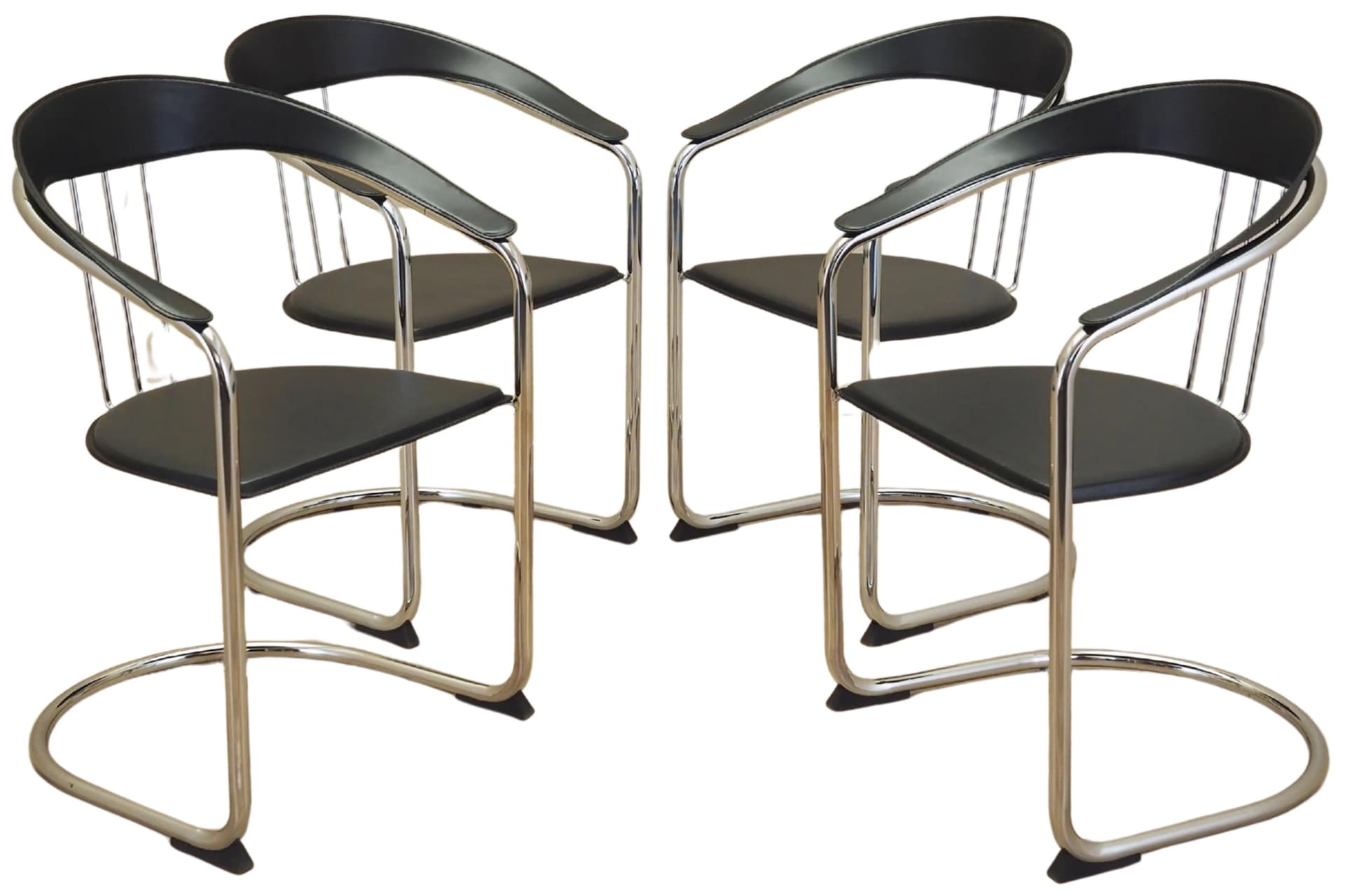 Set of four chairs, black leather, chromed metal, Italy, 1980s.