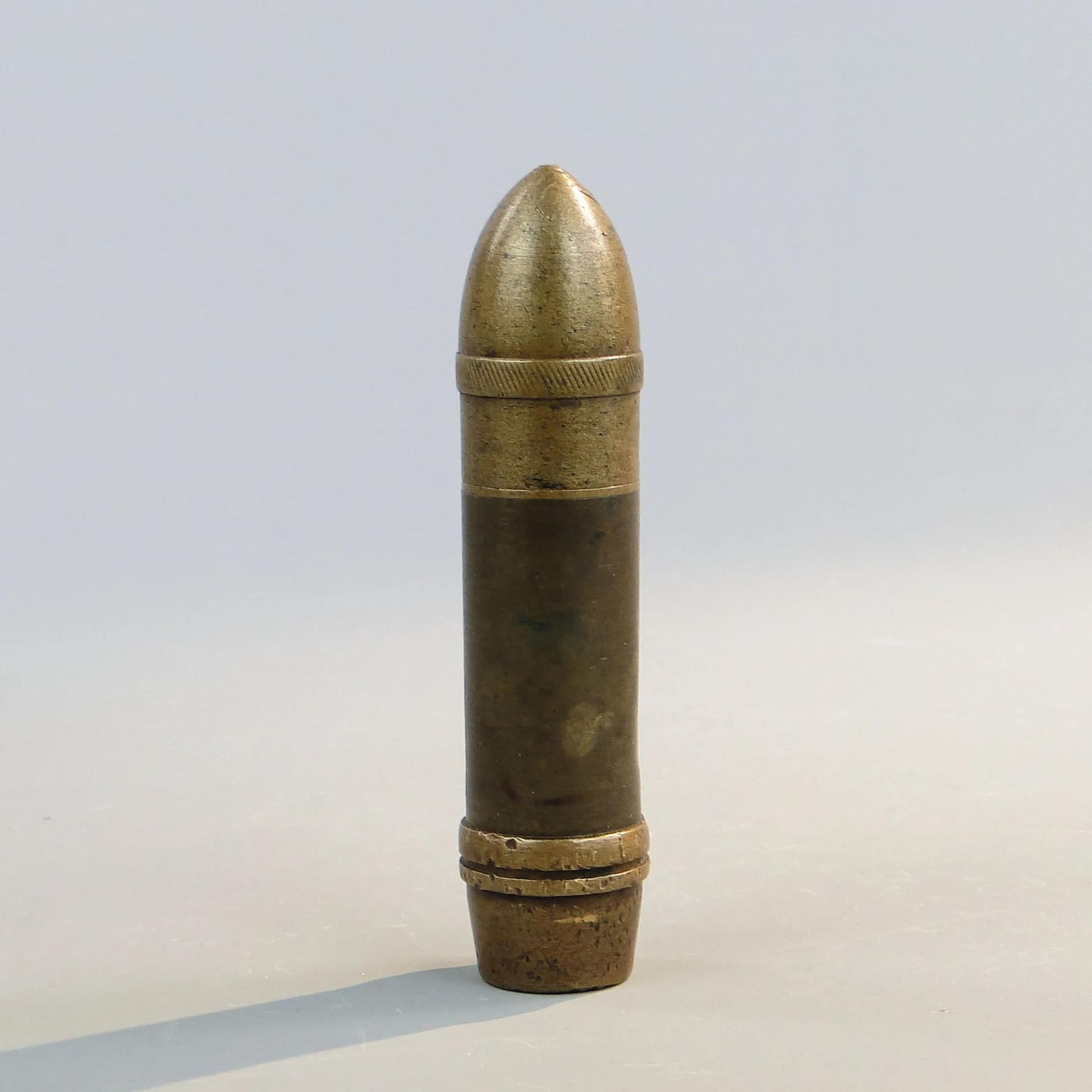 Zapalniczka benzynowa, forma pocisku, miedziany brąz, Polska, początek XX w. - 23631