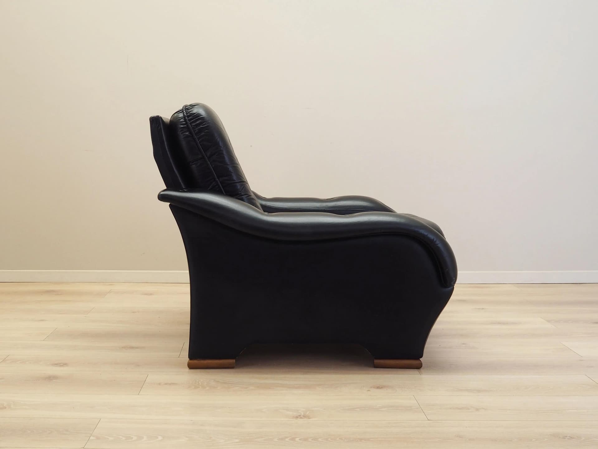 Armchair, postmodernist, black artificial leather, Italy, 1980s. - 23682