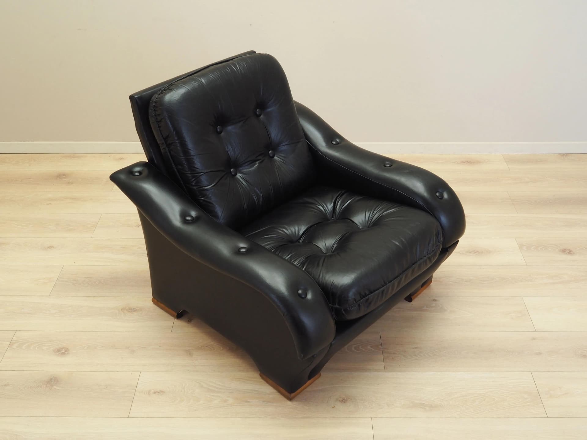 Armchair, postmodernist, black artificial leather, Italy, 1980s. - 23684