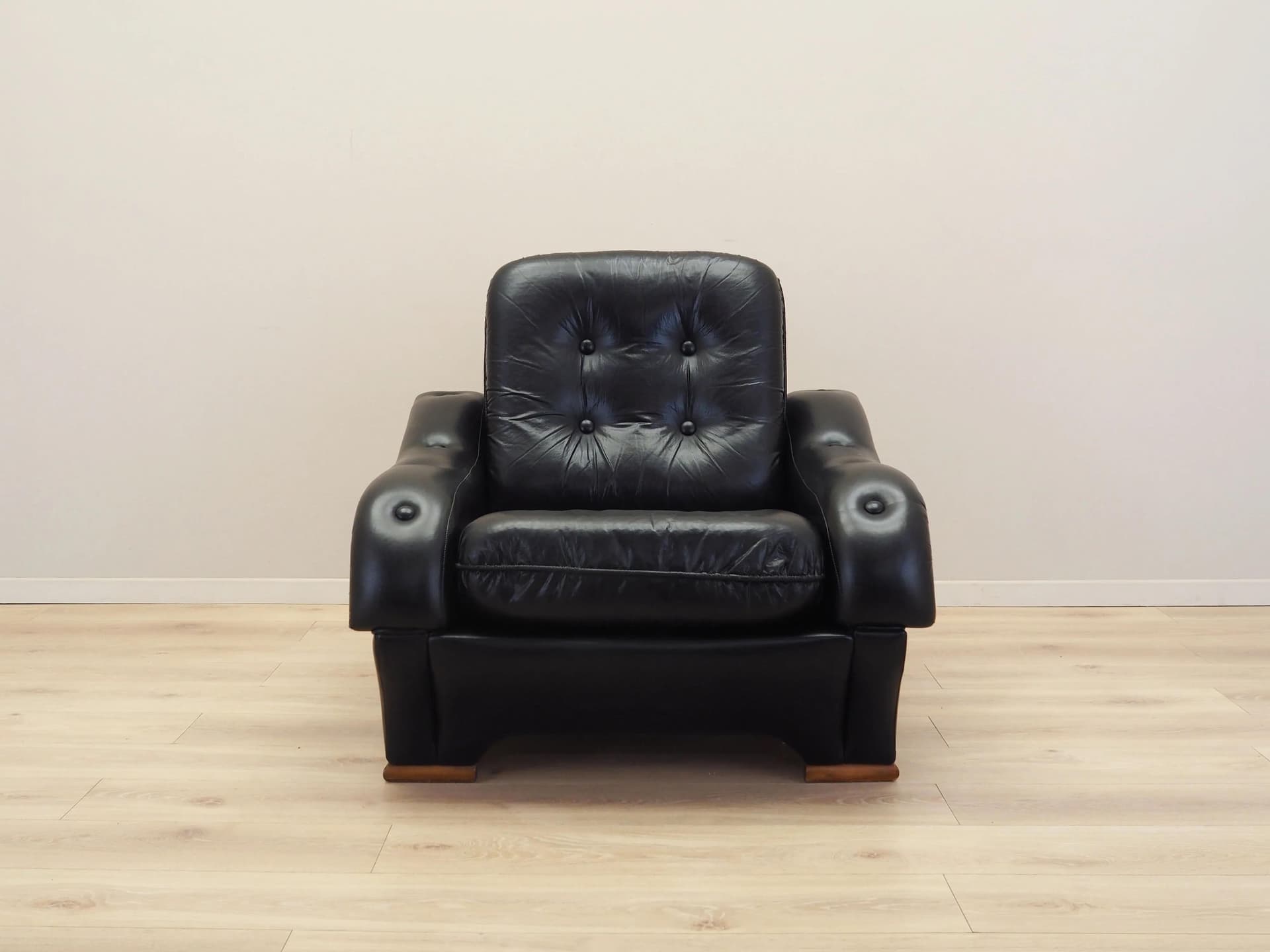 Armchair, postmodernist, black artificial leather, Italy, 1980s. - 23676