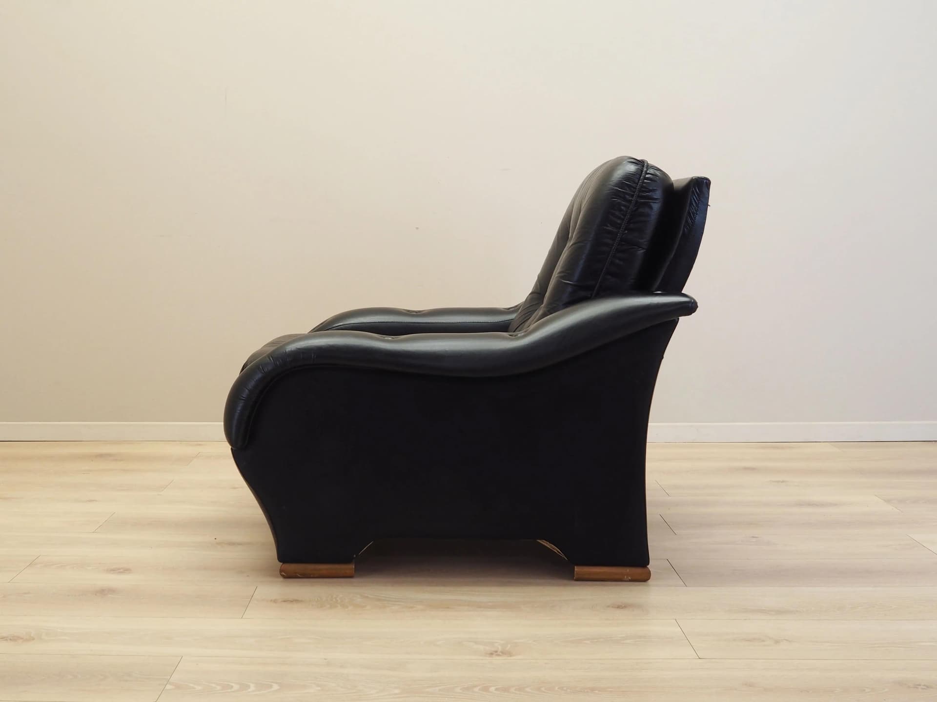 Armchair, postmodernist, black artificial leather, Italy, 1980s. - 23680