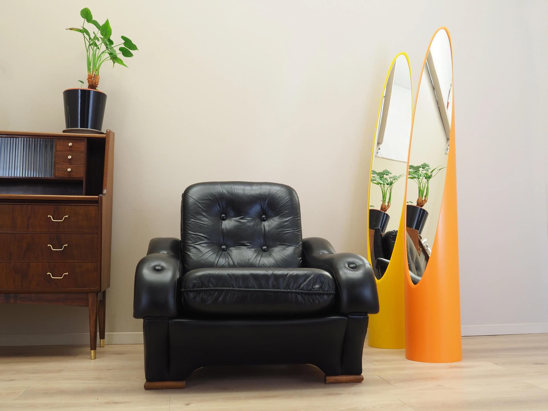 Armchair, postmodernist, black artificial leather, Italy, 1980s. - 23678