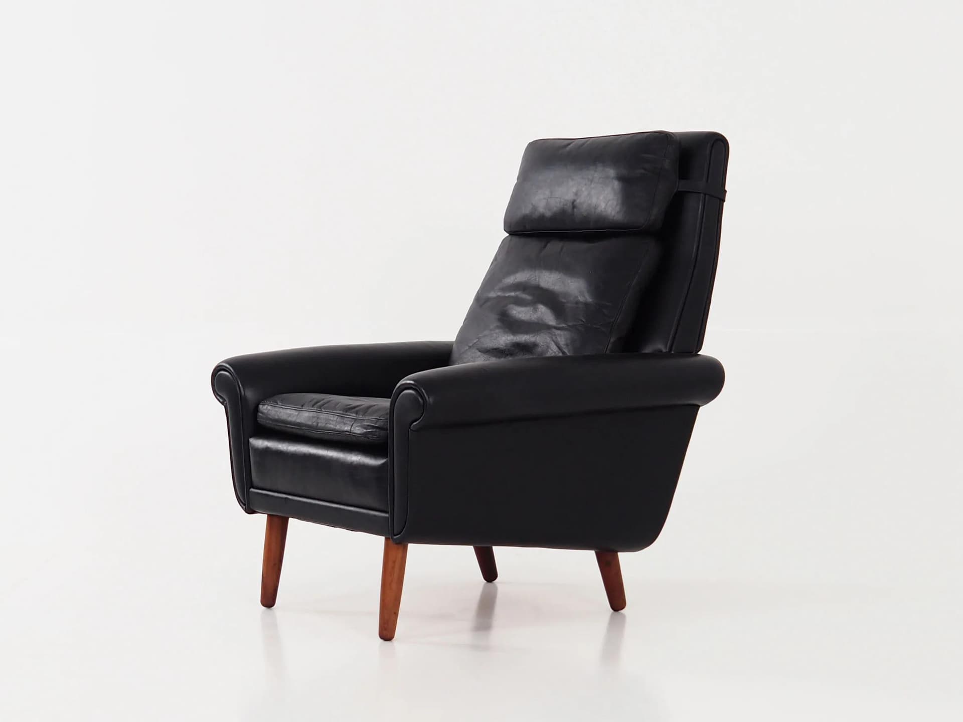 Armchair, black leather, brown rosewood, Denmark, 1970s. - 29807
