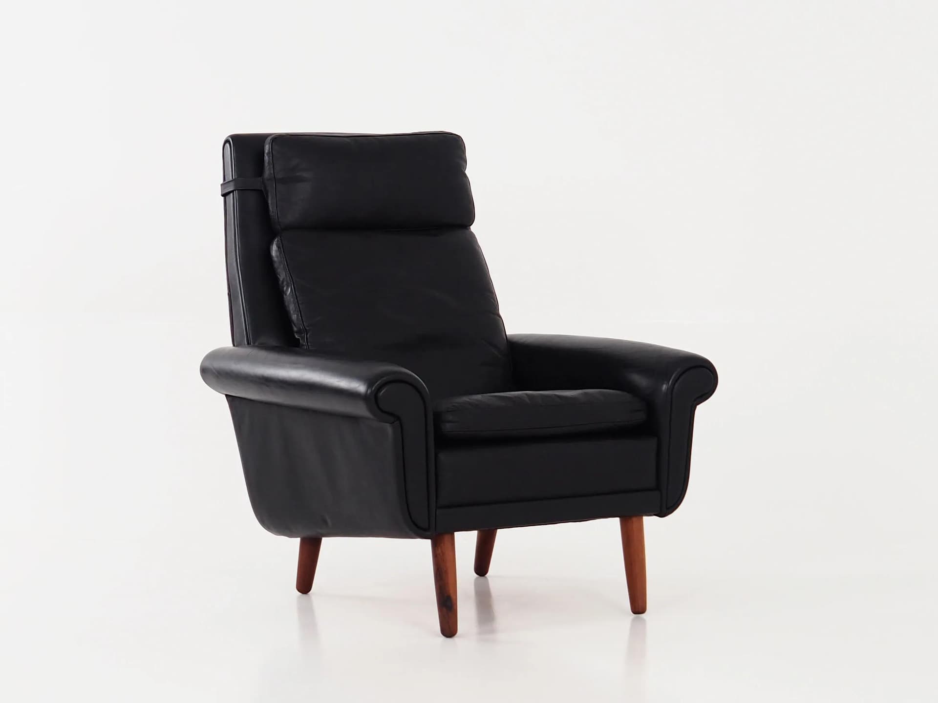 Armchair, black leather, brown rosewood, Denmark, 1970s. - 29811