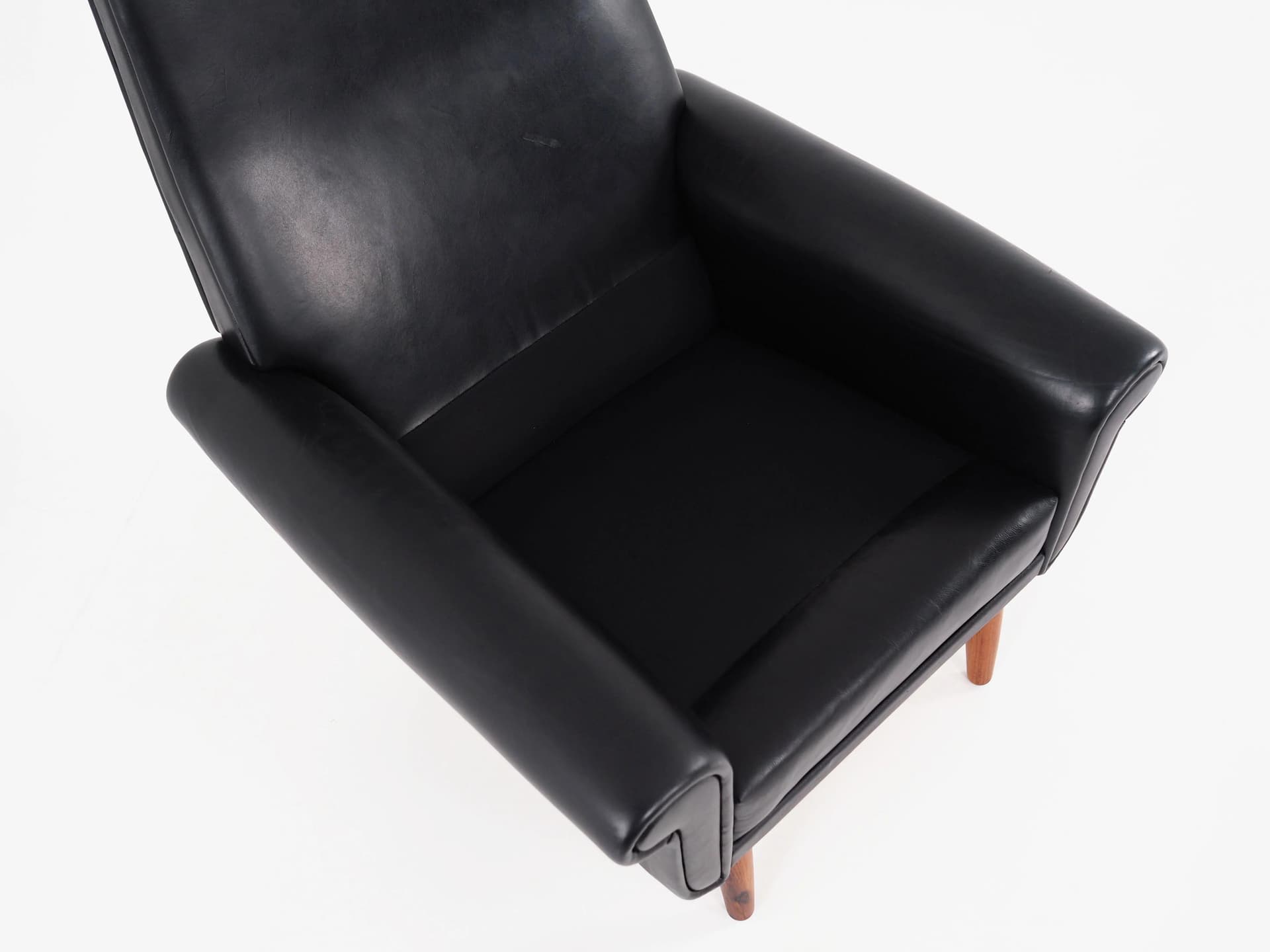 Armchair, black leather, brown rosewood, Denmark, 1970s. - 29813