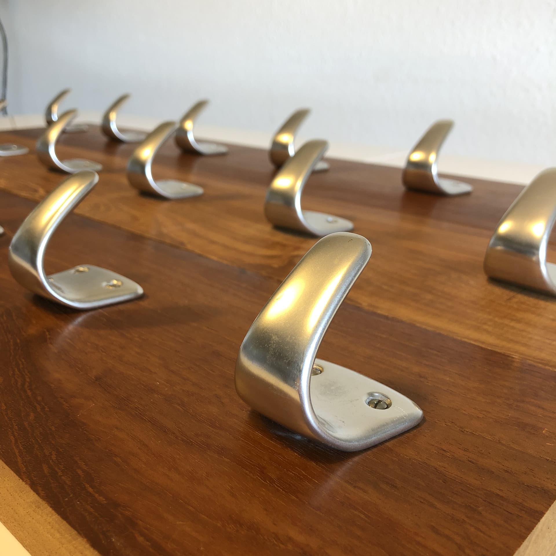 Wall-mounted coat rack, brown teak, silver aluminium, Germany, 1970s. - 33671