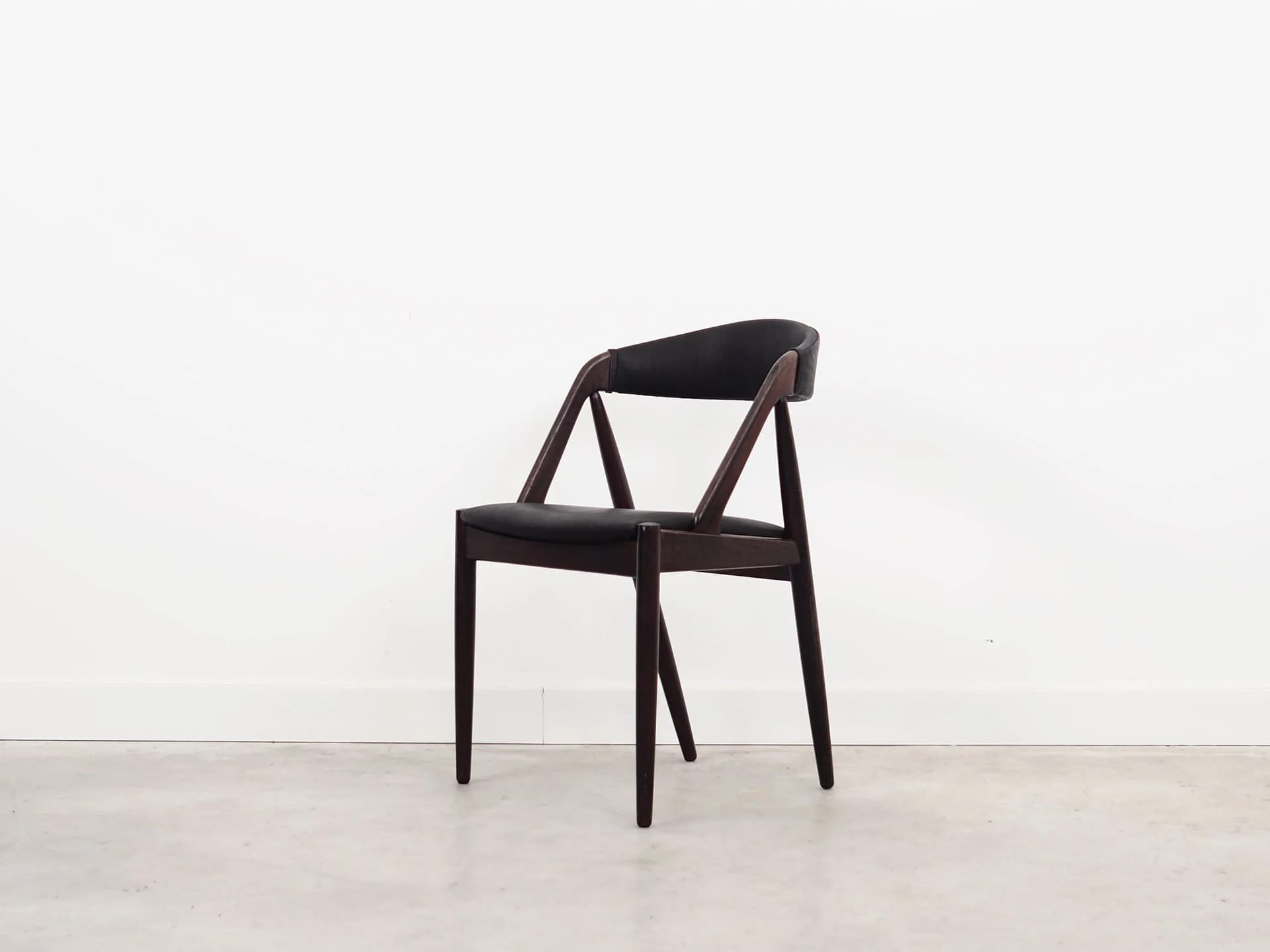 Set of four chairs, brown rosewood, black natural leather, by K. Kristiansen, Denmark, 1970s. - 40134