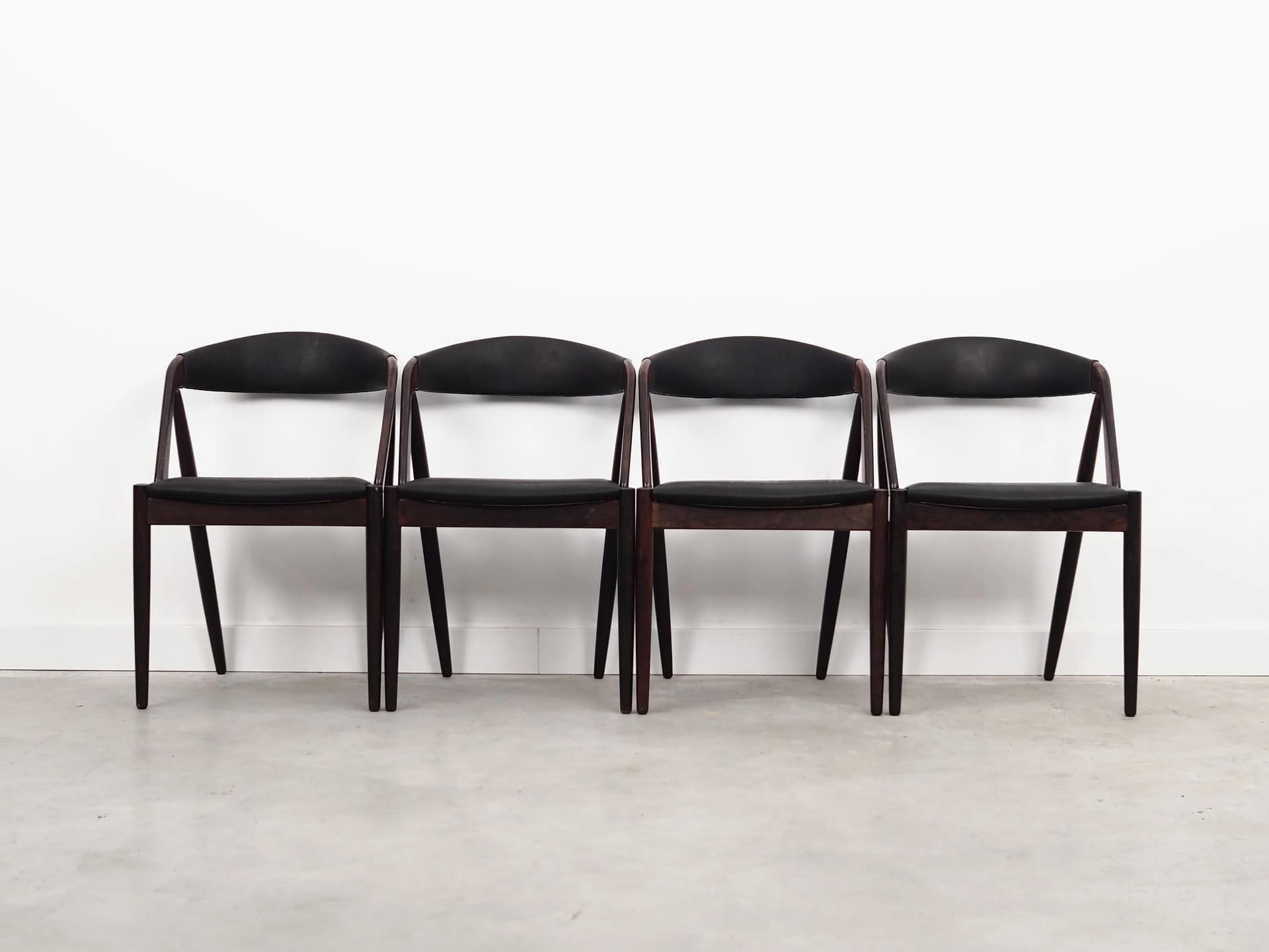Set of four chairs, brown rosewood, black natural leather, by K. Kristiansen, Denmark, 1970s. - 40137