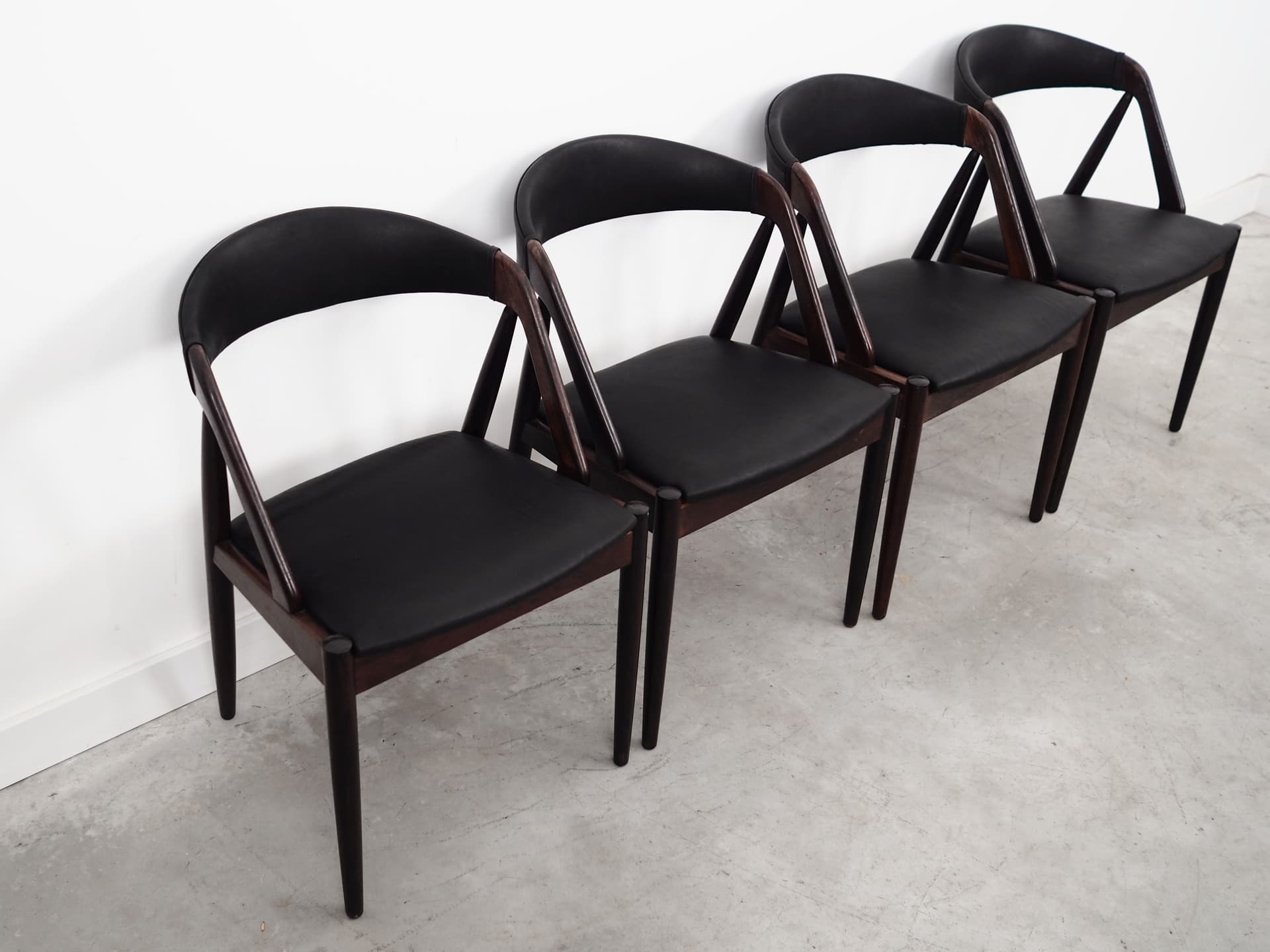 Set of four chairs, brown rosewood, black natural leather, by K. Kristiansen, Denmark, 1970s. - 55986