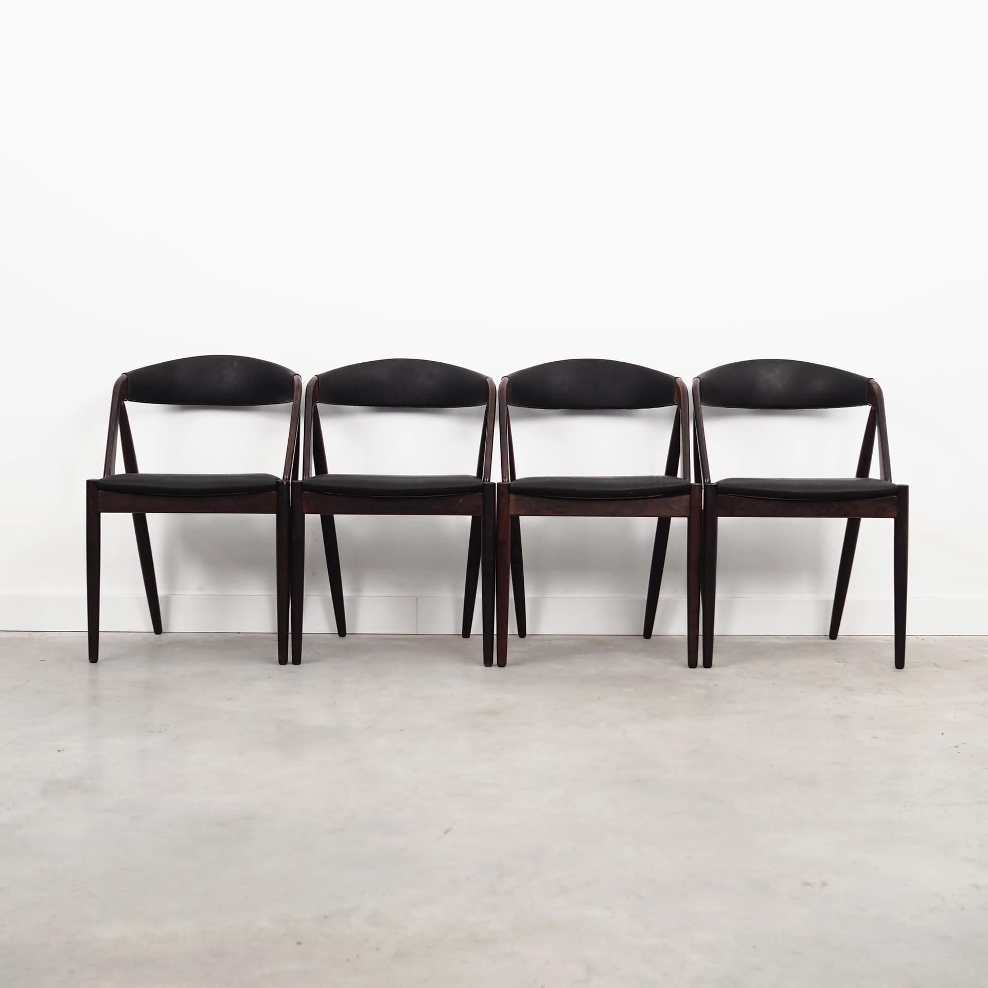 Set of four chairs, brown rosewood, black natural leather, by K. Kristiansen, Denmark, 1970s. - 40138